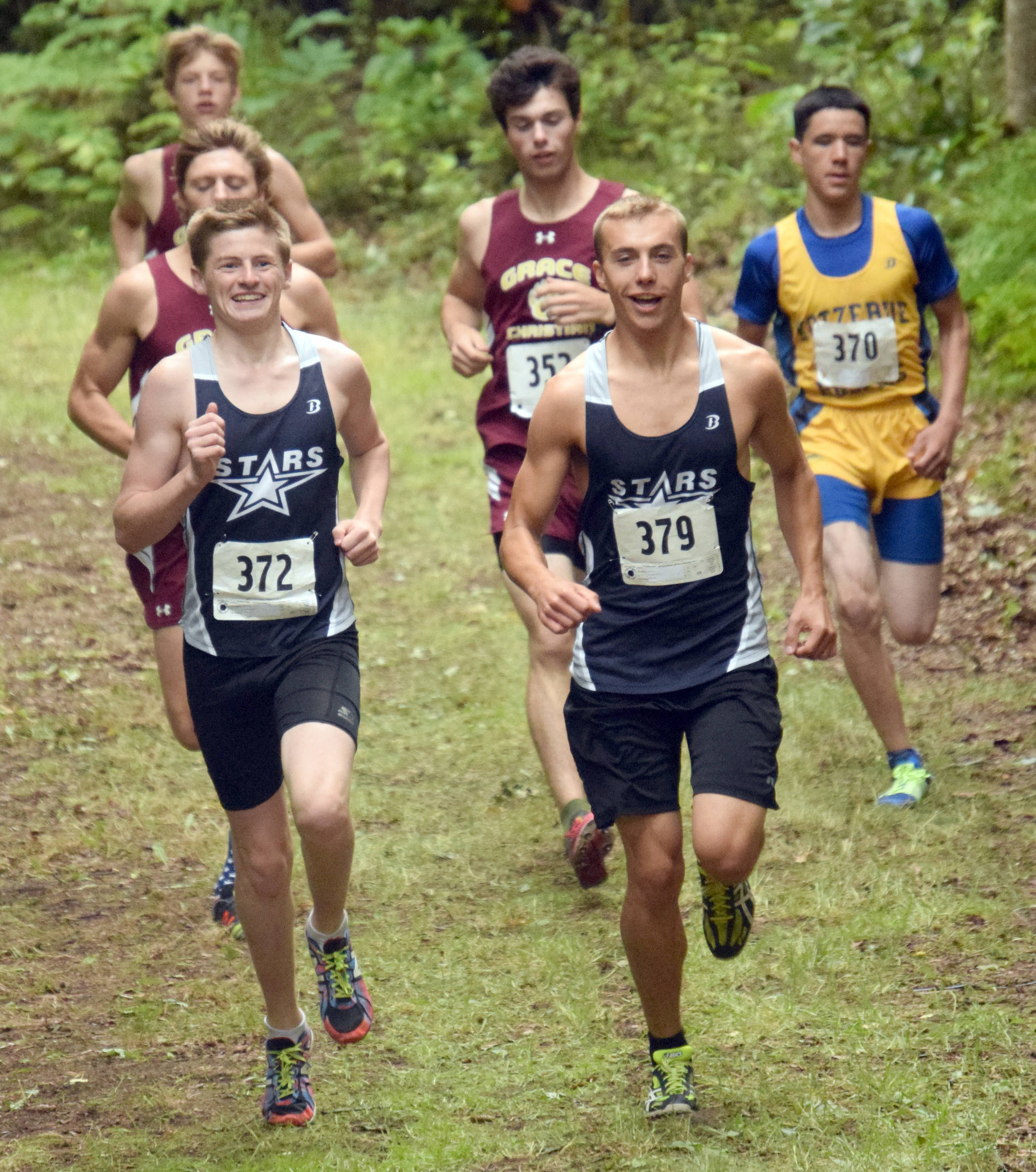 Soldotna juniors Lance Chilton and Bradley Walters relax at the front of the lead pack early in the boys junior-senior race Monday, Aug. 13, 2018, at the Nikiski Class Races at Nikiski High School. (Photo by Jeff Helminiak/Peninsula Clarion)