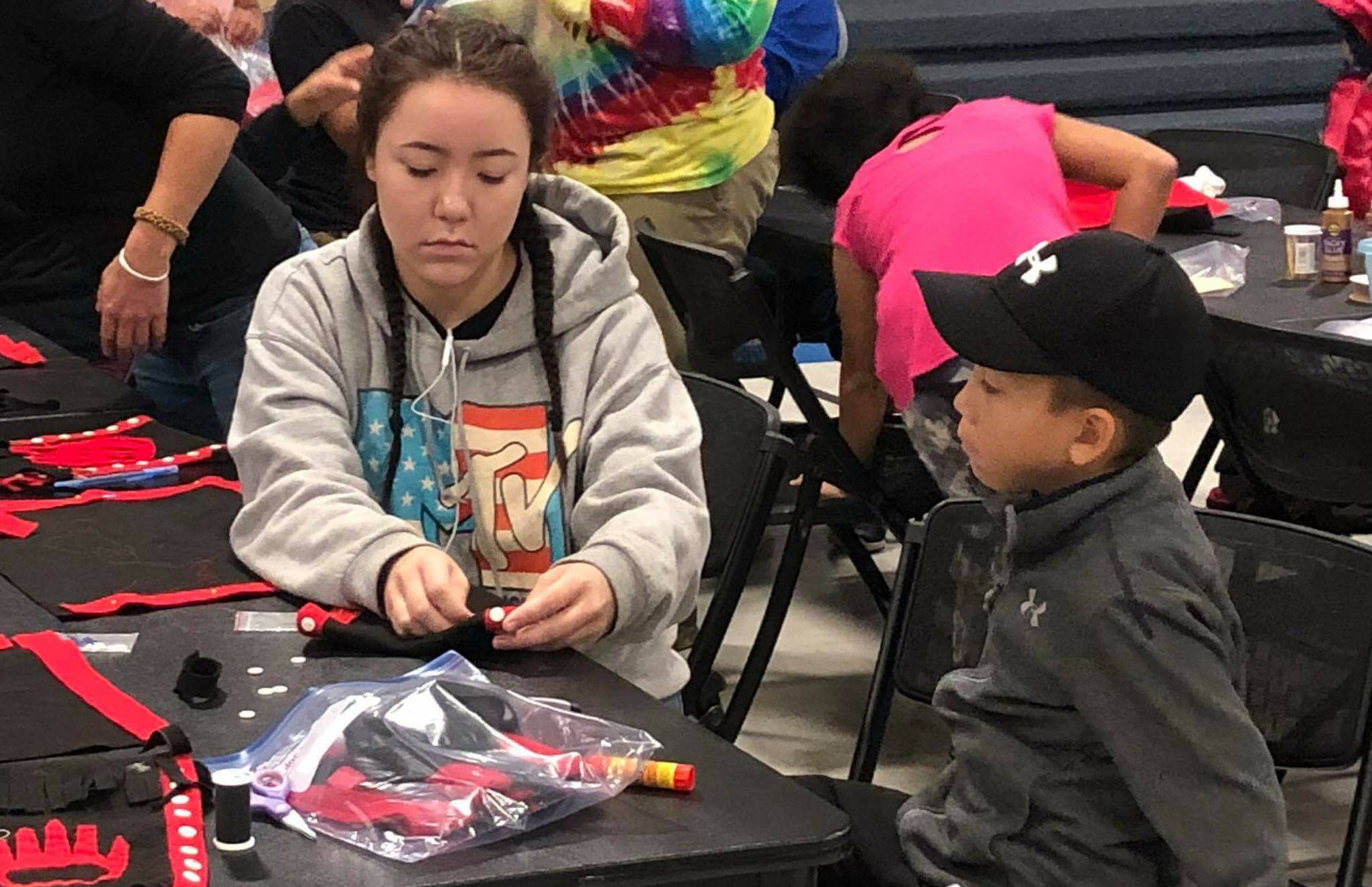 Rose Willard<span class="IDappliedStyle" title="InDesign: Book"> | Courtesy Photo</span>                                Sydney Johnson helps her brother Tristan with an art project at an Alaska Native culture camp on Thursday, Aug. 2.