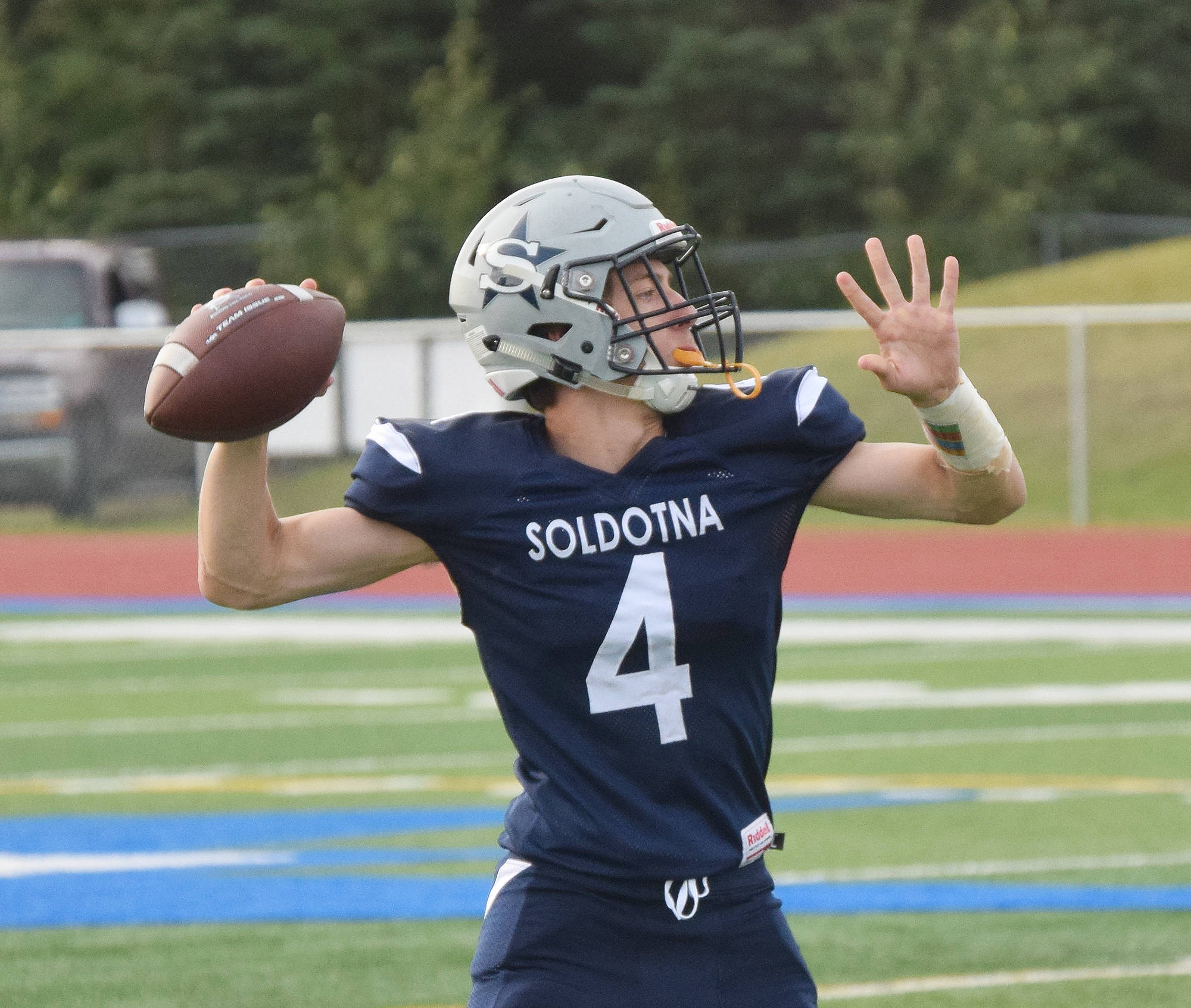 Soldotna junior Jersey Truesdell winds up for a pass Friday against North Pole at Soldotna’s Justin Maile Field. (Photo by Joey Klecka/Peninsula Clarion)