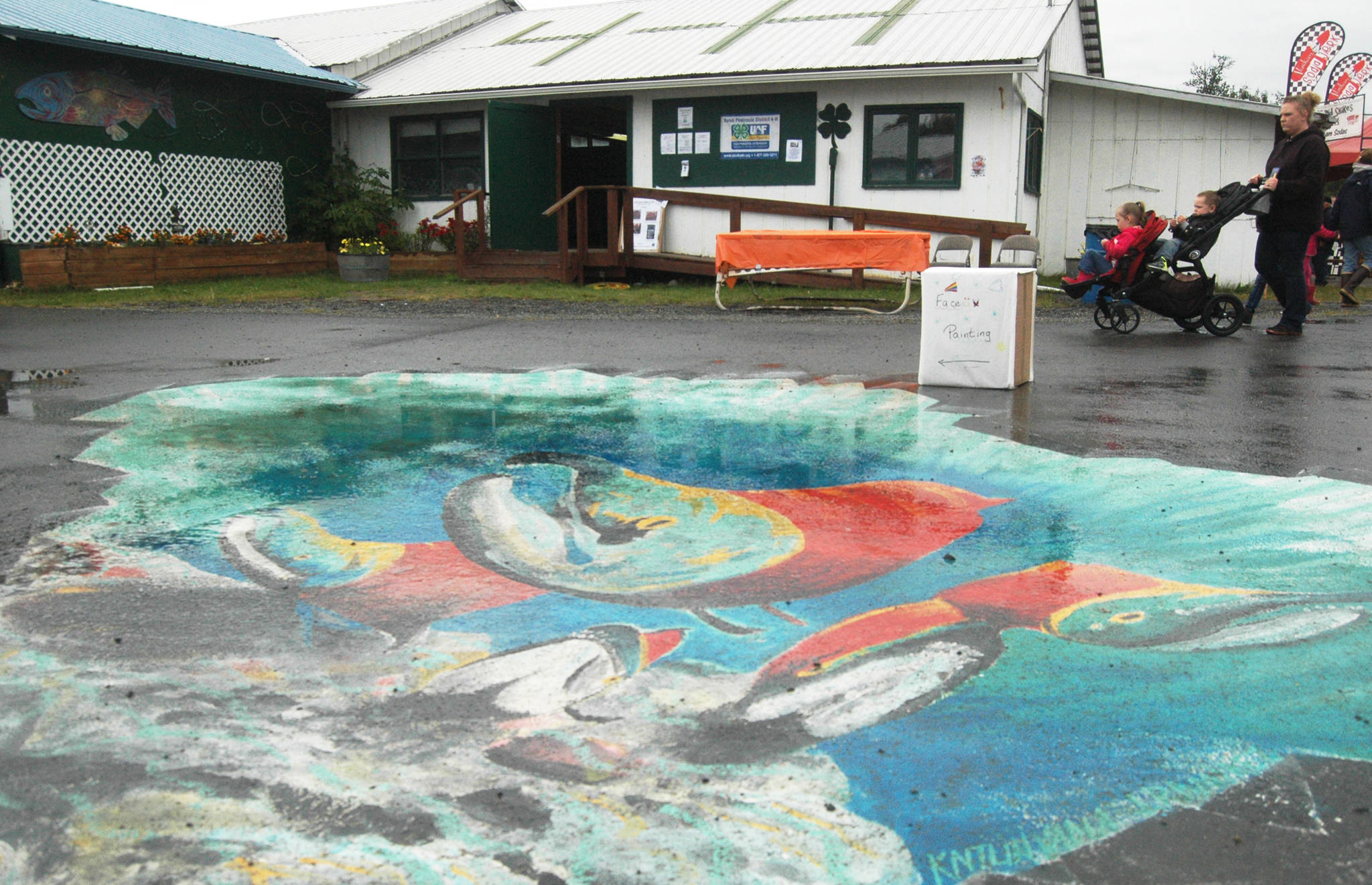 A mural decorates the pavement at the Kenai Peninsula Fairgrounds at the fair on Saturday, Aug. 18, 2018 in Ninilchik, Alaska. (Photo by Elizabeth Earl/Peninsula Clarion)