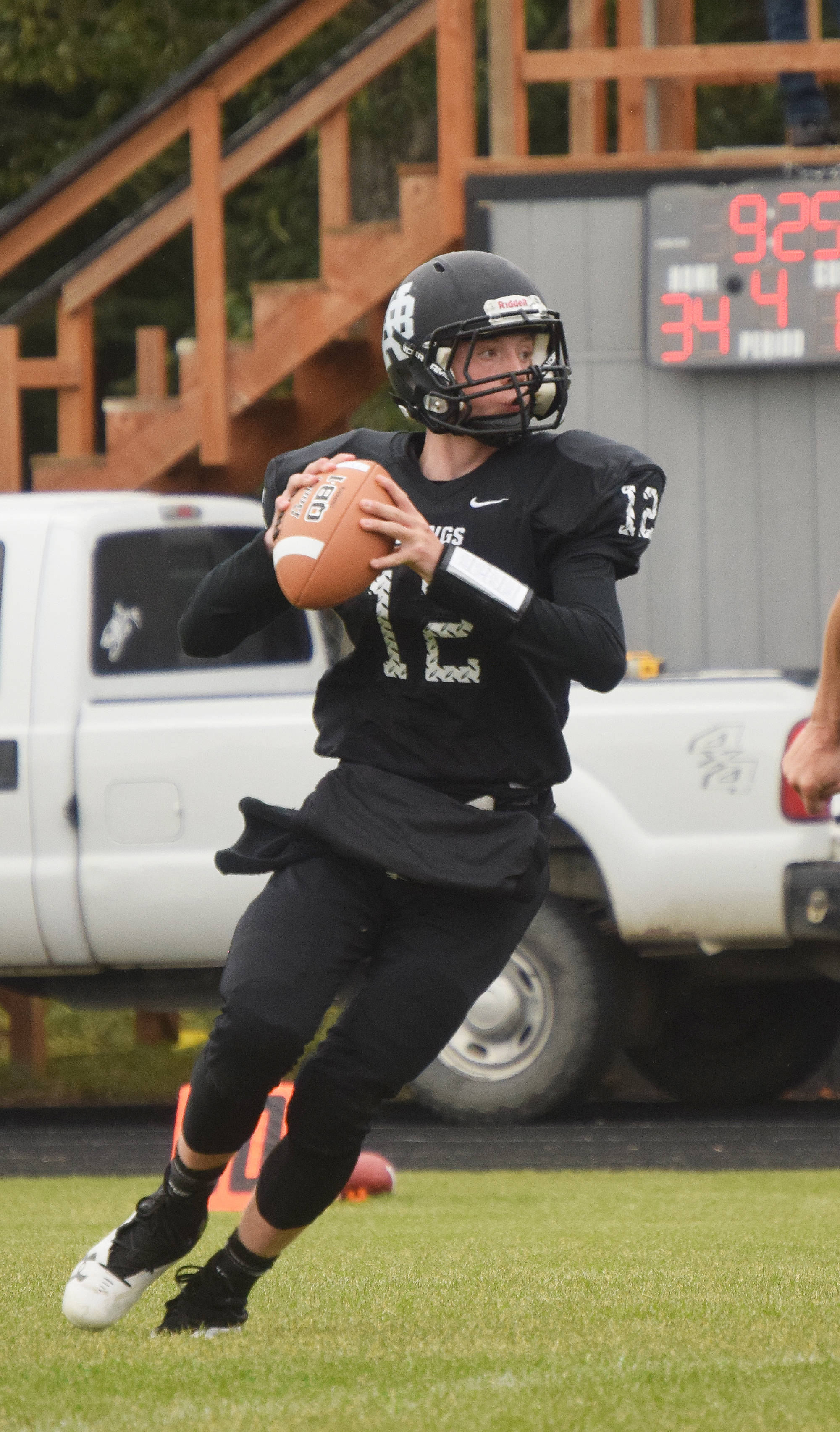 Nikiski junior Noah Litke scans the field for an open receiver Saturday against Valdez at Nikiski High School. (Photo by Joey Klecka/Peninsula Clarion)