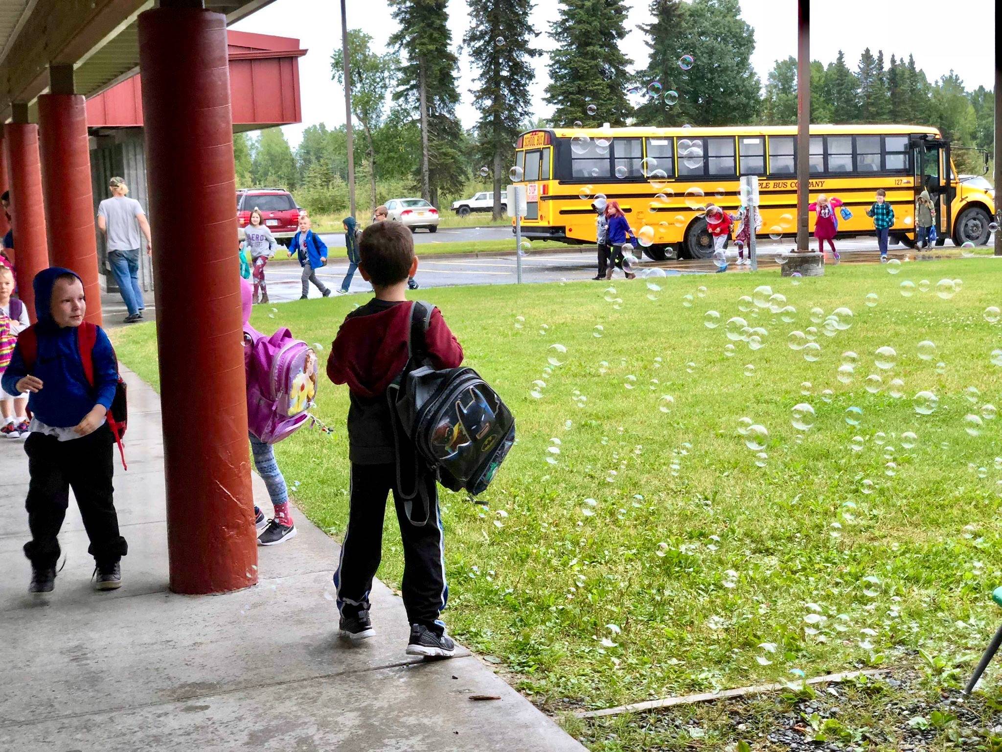 Students were welcomed to their first day of school with bubbles and jazz music on Tuesday, Aug. 21, 2018, at Mountain View Elementary in Kenai, Alaska. (Photo by Victoria Petersen/Peninsula Clarion)