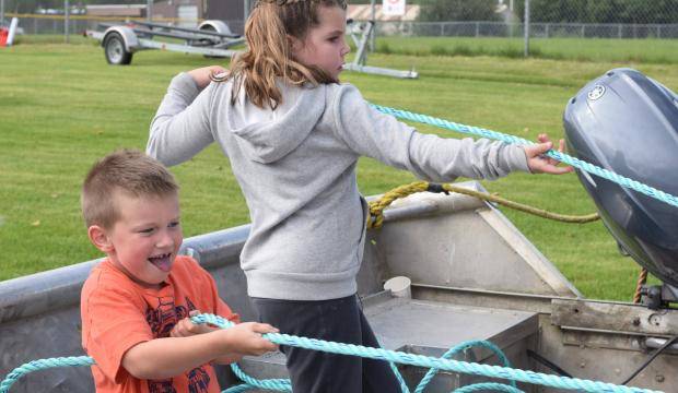 Cody Schaefer, left, and Shayla Smith compete against each other in a net pull at Industry Appreciation Day on Saturday, Aug. 26, 2017 in Kenai, Alaska. (Photo by Kat Sorensen/Peninsula Clarion)