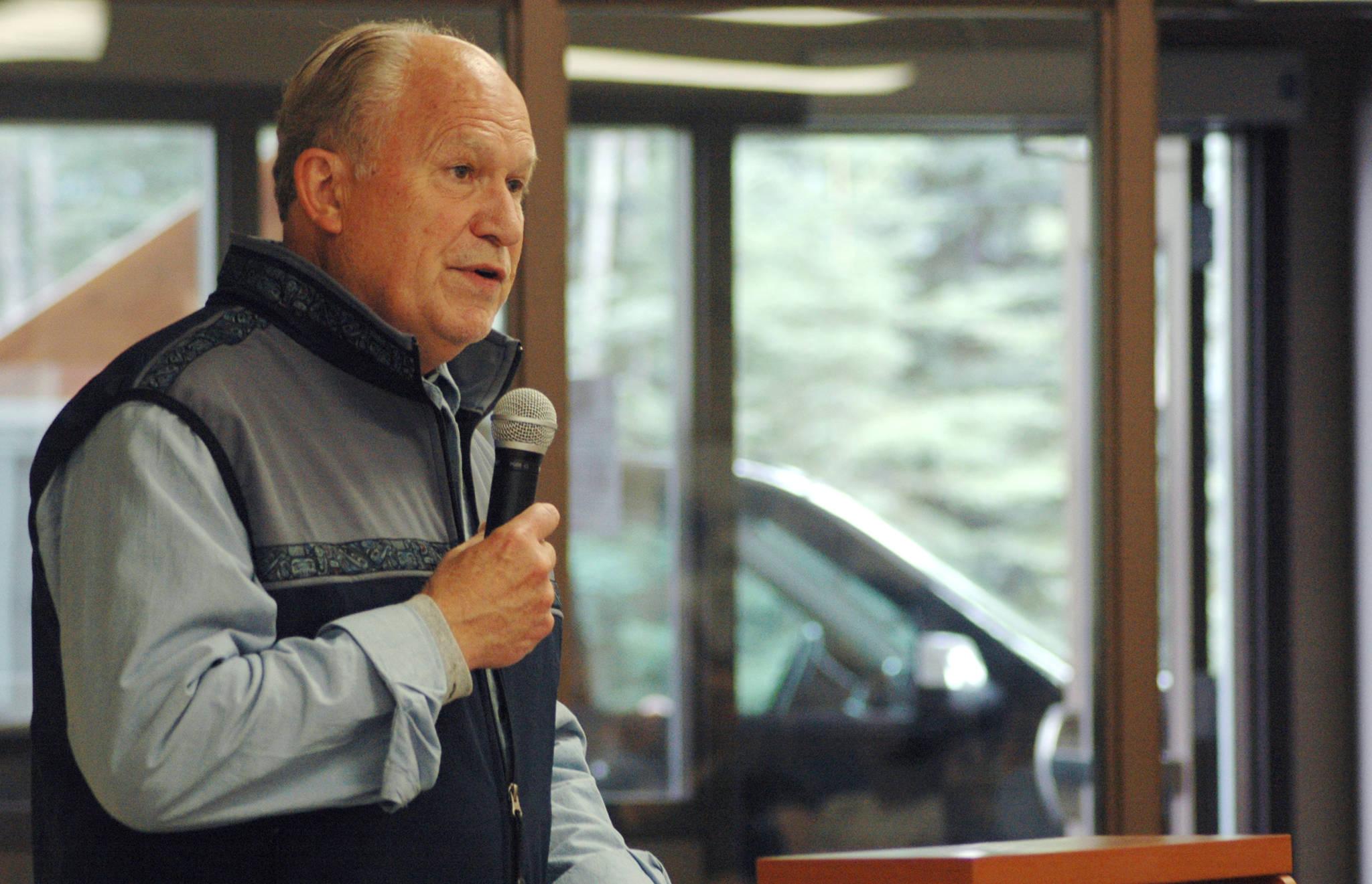 Gov. Bill Walker speaks to a crowd gathered at Hope Community Resources’ building on Kalifornsky Beach Road during a signing ceremony for Senate Bill 174 on Saturday, Aug. 25, 2018 in Soldotna, Alaska. (Photo by Elizabeth Earl/Peninsula Clarion)