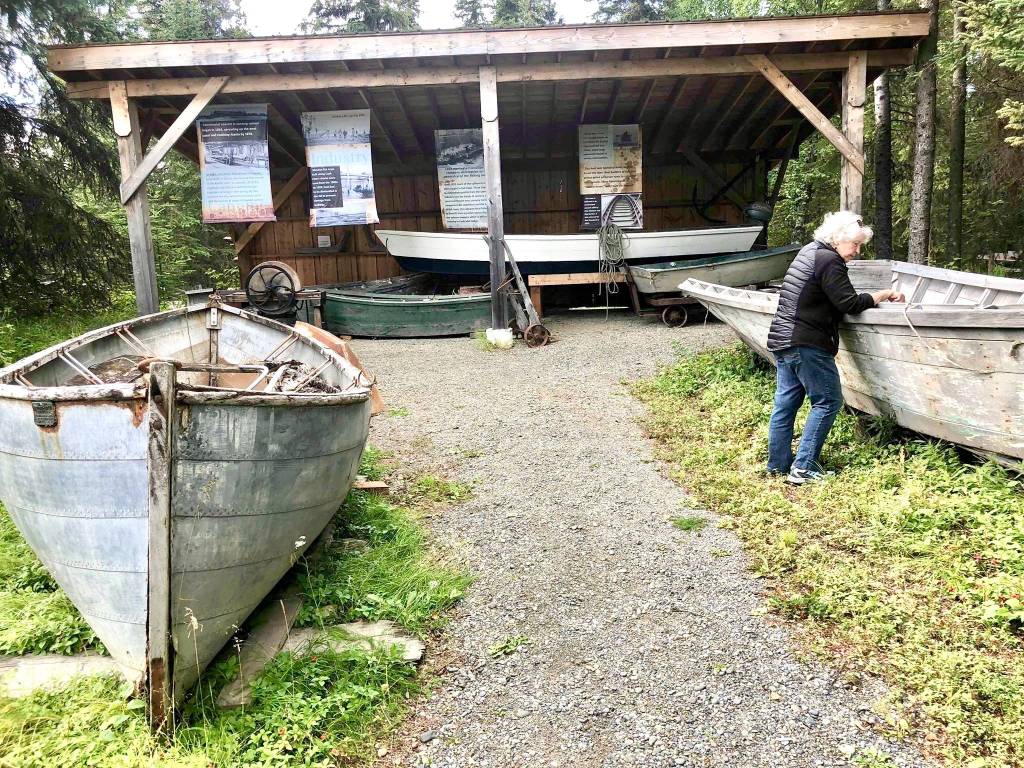 Vice President of the Kasilof Regional Historical Association, Alicia Morgan walks along the museum’s boat yard on Wednesday, Aug. 29, 2018, in kasilof, Alaska. (Photo by Victoria Petersen/Peninsula Clarion)