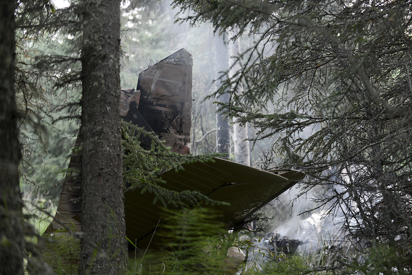 Emergency responders from Central Emergency Services respond to the scene of a fatal plane crash on Saturday August 22, 2015 on South Coho Loop Road in Kasilof, Alaska.