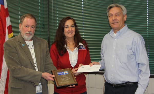 United Way 2013 Campaign Chair Gary Turner & executive director Lisa Roberts receive a $19k check from Ray Tauriainen of the Nikiski ConocoPhillips LNG plant.