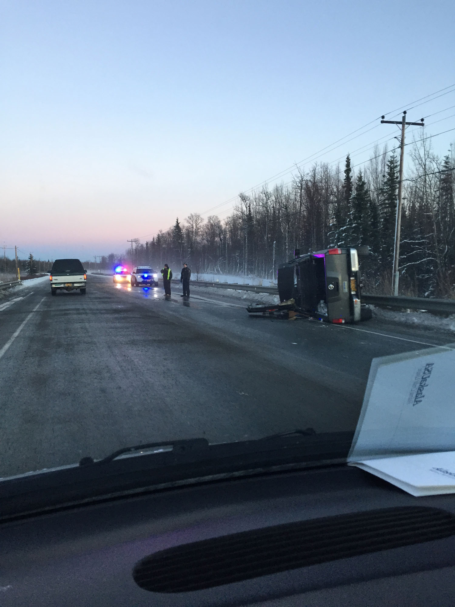 Kenai Police close one lane of the Kenai Spur Highway Tuesday afternoon in response to a vehicle rollover near Mile 8.