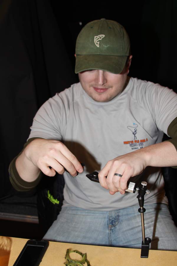 Brenden Shiflea ties a fly at Trout Unlimited workshop at Main Street Tap & Grill.