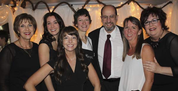 The 2014 Hospice of the Central Peninsula board of directors take a bow at annual winter wine tasting event.