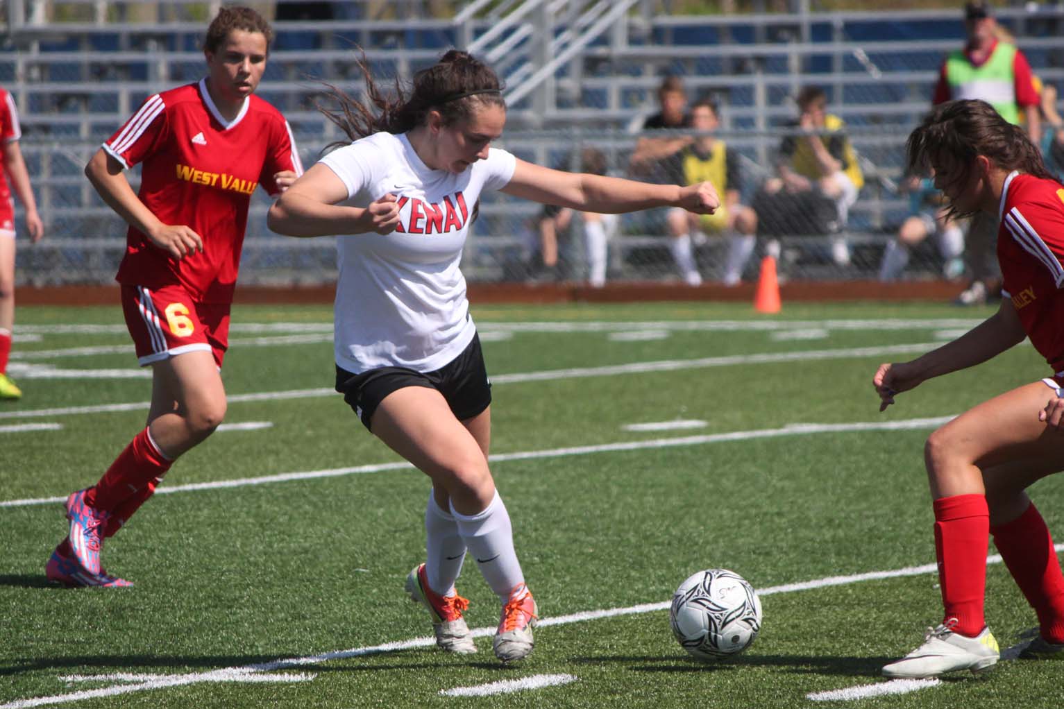 Kenai sophomore Cassie Holmes moves the ball downfield against West Valley in Friday's state soccer semifinal round at Bartlett High School in Anchorage. The Kardinals lost 2-0.