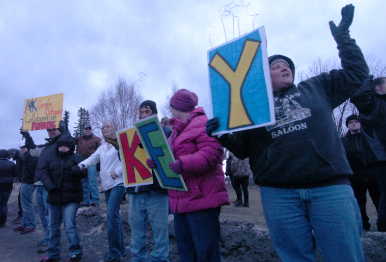 Local members of the Key Coalition rally at Soldotna Creek Park Friday.