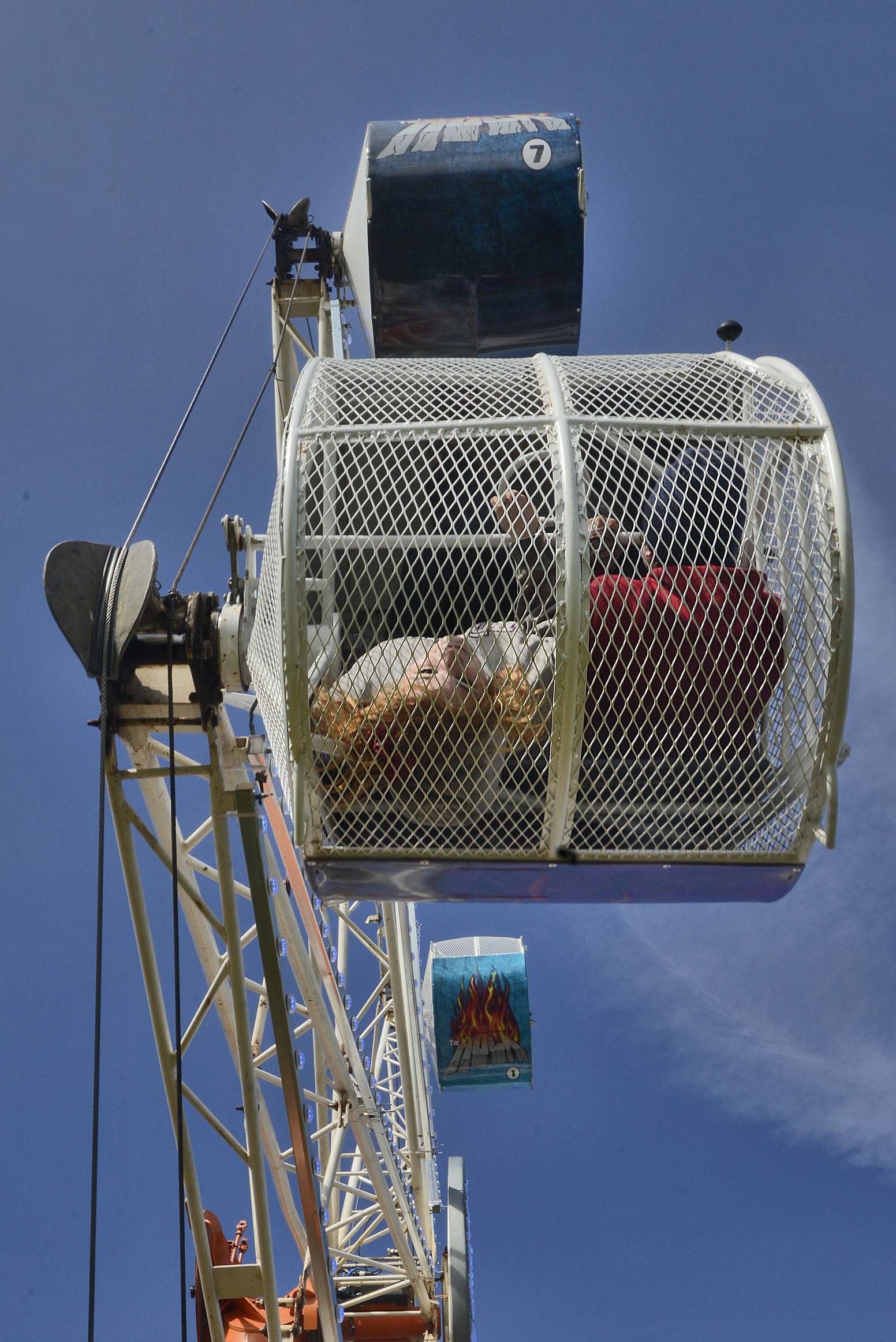 The Rock ferris wheel allows riders to spin inside of their cage as the wheel turns during the Golden Wheel Amusements carnival in Kenai, Alaska.