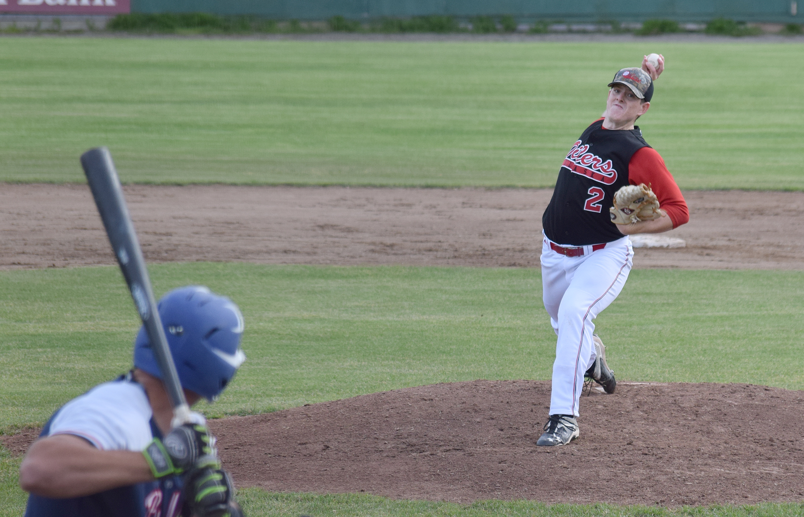 Peninsula Oilers pitcher Billy Oxford winds up for the pitch Friday night against the Anchorage Glacier Pilots at Coral Seymour Memorial Park in Kenai.