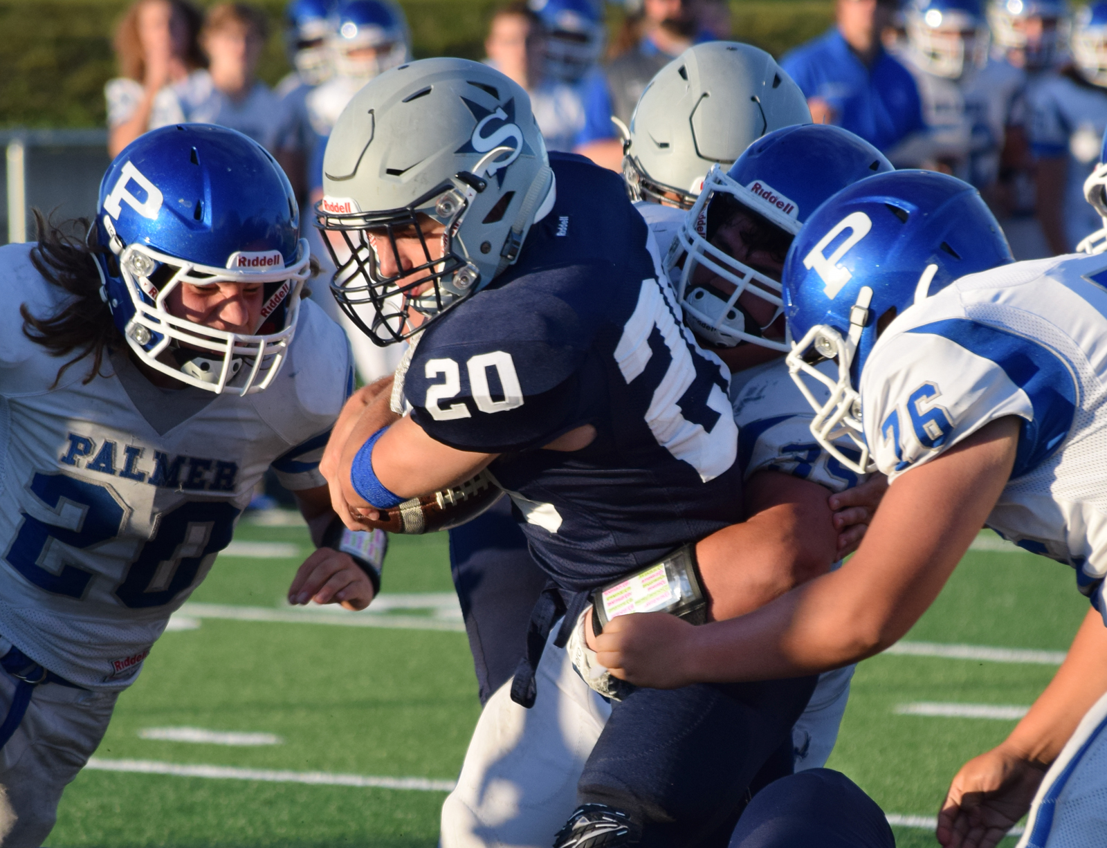 Soldotna running back Austin Schrader (20) rumbled up the middle for a gain Friday evening against Palmer at Justin Maile Field in Soldotna.