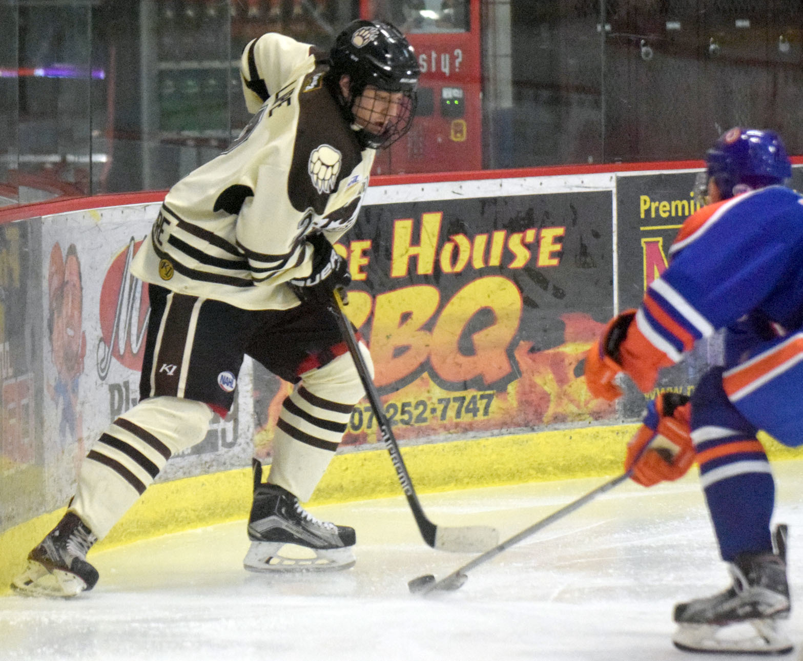 Kenai River Brown Bears defenseman Christopher Lipe plays along the boards Friday, Jan. 27, 2017, against the Northeast (Massachusetts) Generals at the Soldotna Regional Sports Complex. (Photo by Jeff Helminiak/Peninsula Clarion)