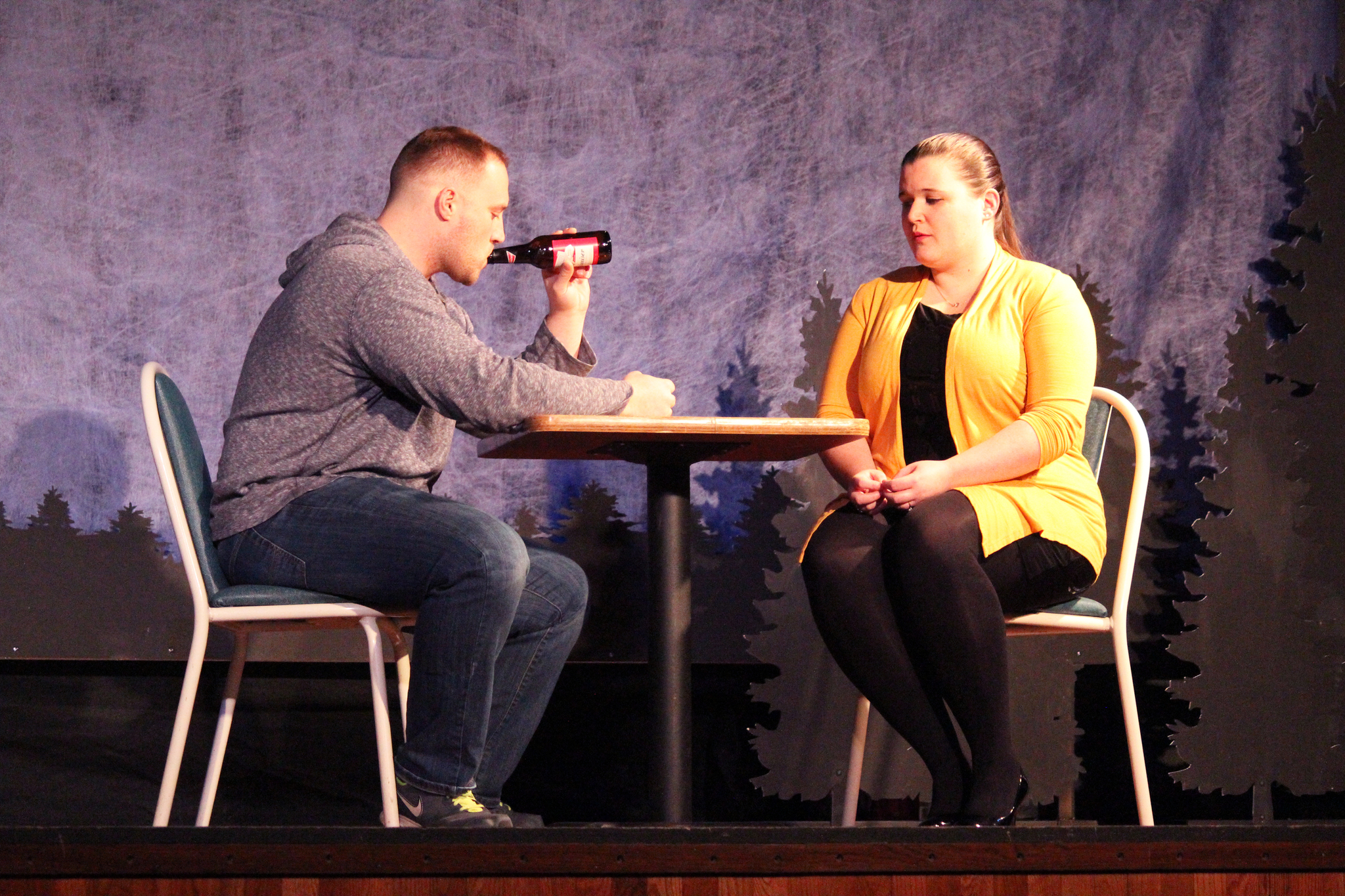 Tyler Payment and Kate Schwarzer act out a scene from the play “Almost, Maine,” during a rehearsal Wednesday, Feb. 8, 2017 at the Triumvirate Theatre in North Kenai, Alaska. The play is set to run Friday and Saturday.