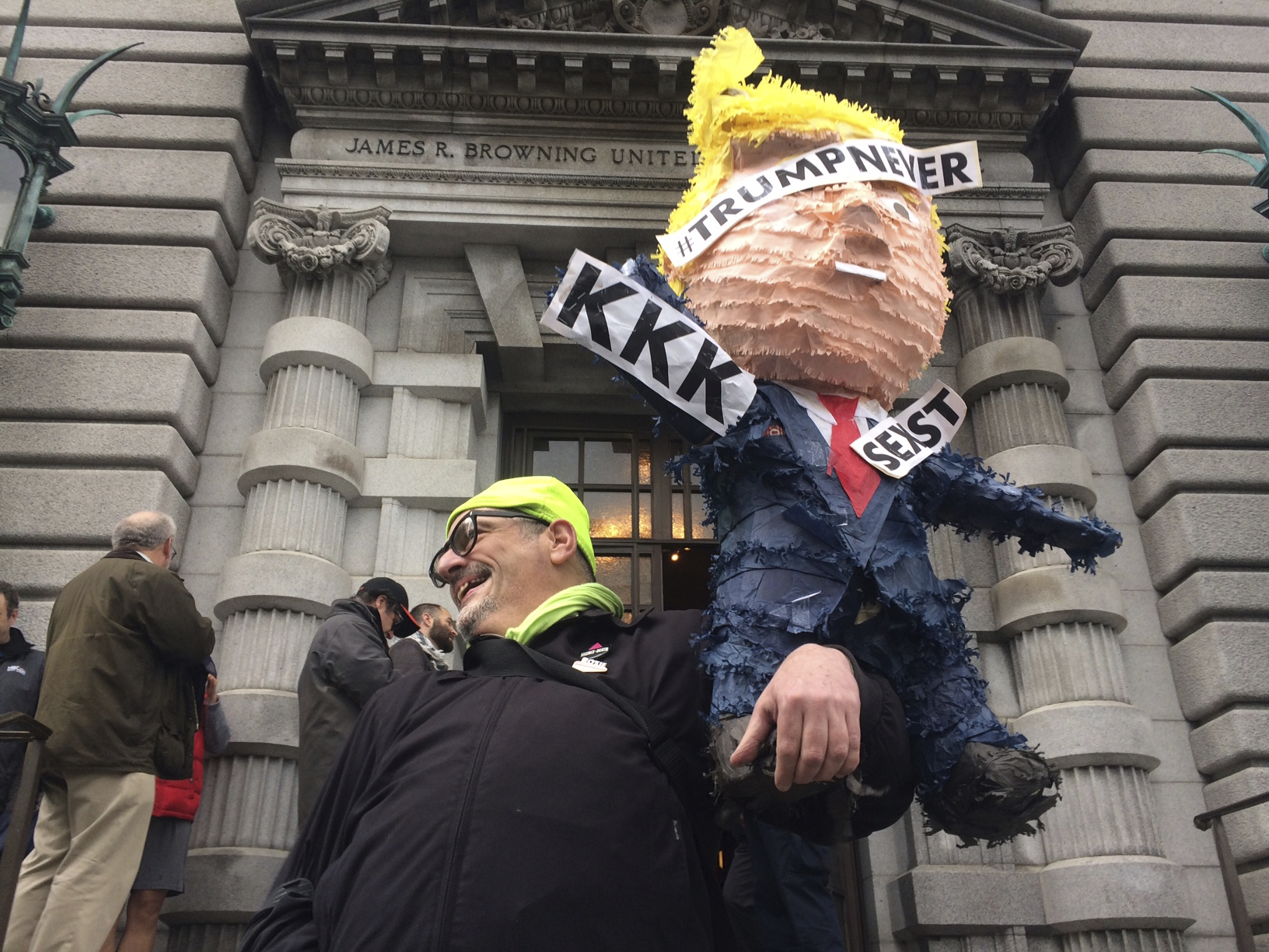 Activity is seen outside the 9th U.S. Circuit Court of Appeals building in San Francisco on Thursday, Feb. 9, 2017. A federal appeals court refused Thursday to reinstate President Donald Trump's ban on travelers from seven predominantly Muslim nations, dealing another legal setback to the new administration's immigration policy. The states said Trump's travel ban harmed individuals, businesses and universities. Citing Trump's campaign promise to stop Muslims from entering the U.S., they said the ban unconstitutionally blocked entry to people based on religion. (AP Photo/Haven Daley)