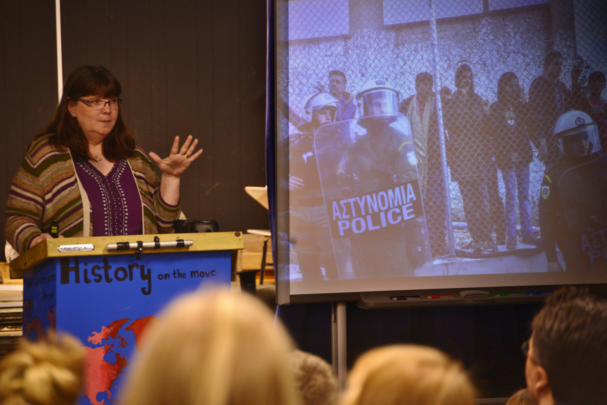 Retired paramedic Teresa Gray presents images from her aid work in refugee camps on the Greek island of Lesbos to Kenai Central High School juniors and seniors on Tuesday, Feb. 14, 2017 in Kenai, Alaska. (Ben Boettger/Peninsula Clarion)