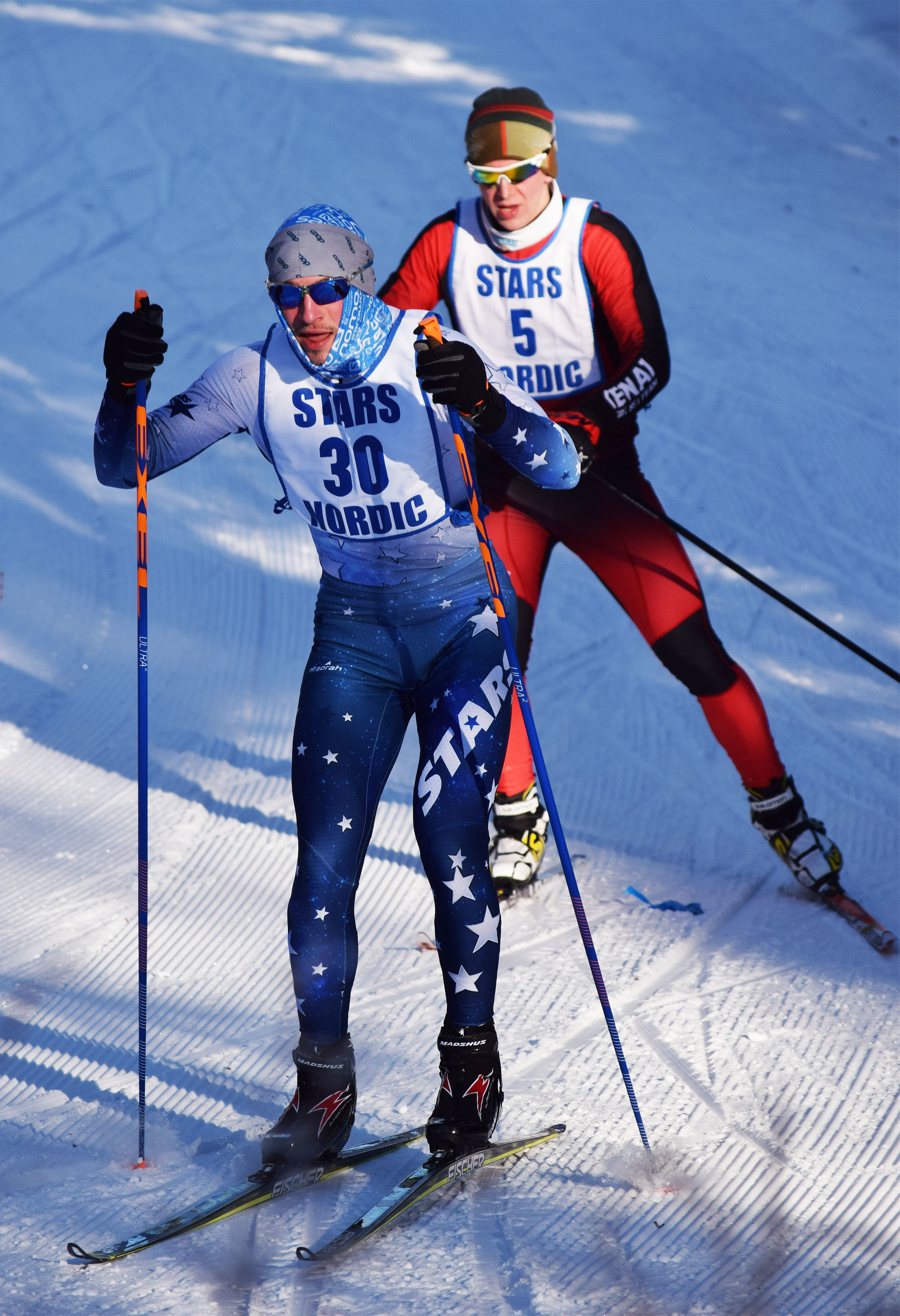 Soldotna’s Koby Vinson (30) and Kenai Central’s Karl Danielson race for the lead at the Kenai Peninsula Borough meet Saturday, Feb. 11, at the Tsalteshi Trails. (Photo by Joey Klecka/Peninsula Clarion)