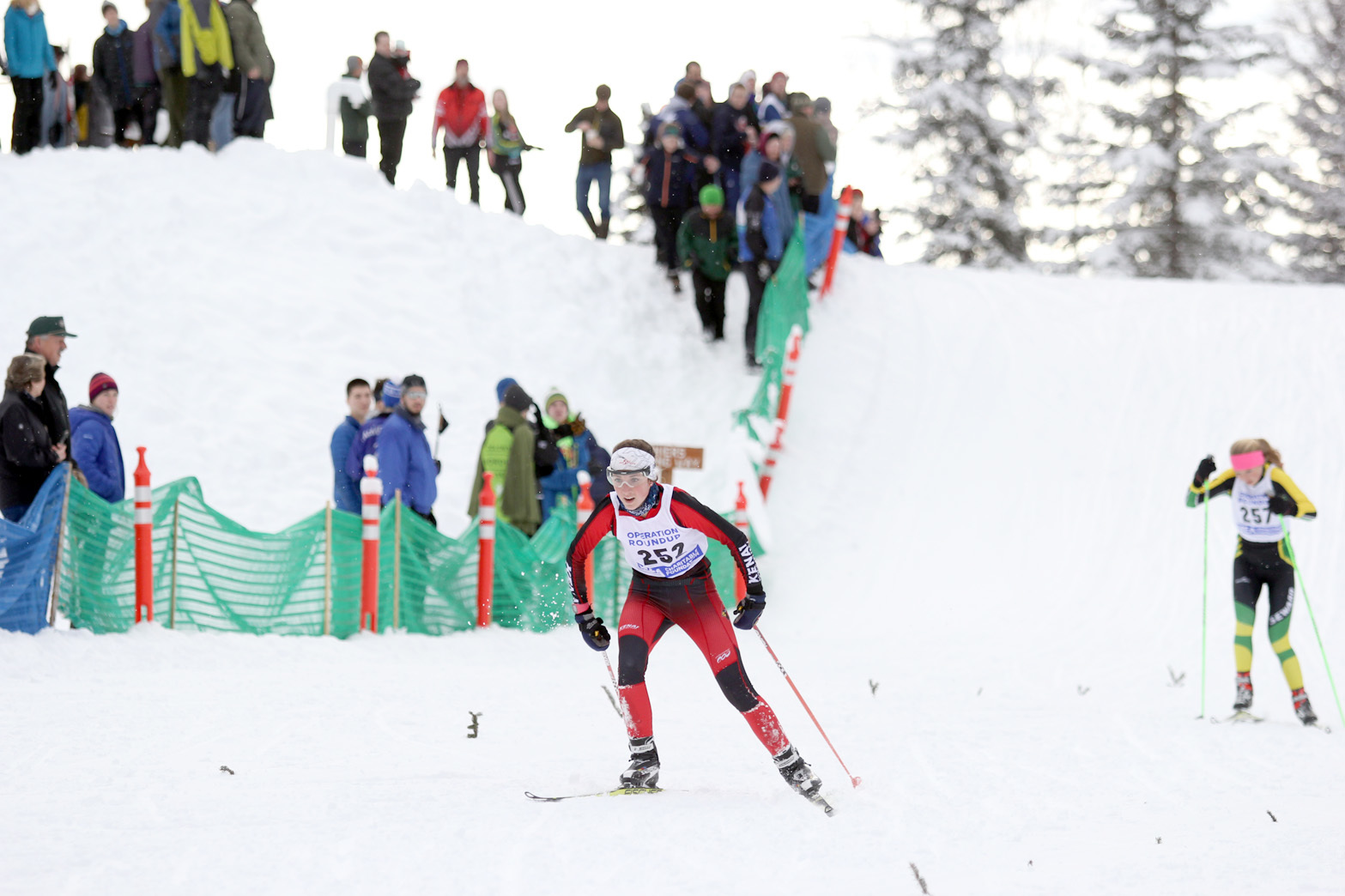Kenai Central’s Riana Boonstra leads Seward’s Ruby Lindquist on Saturday at the Region III ski meet at Government Peak. (Photo by Caitlin Skvorc/For the Frontiersman)