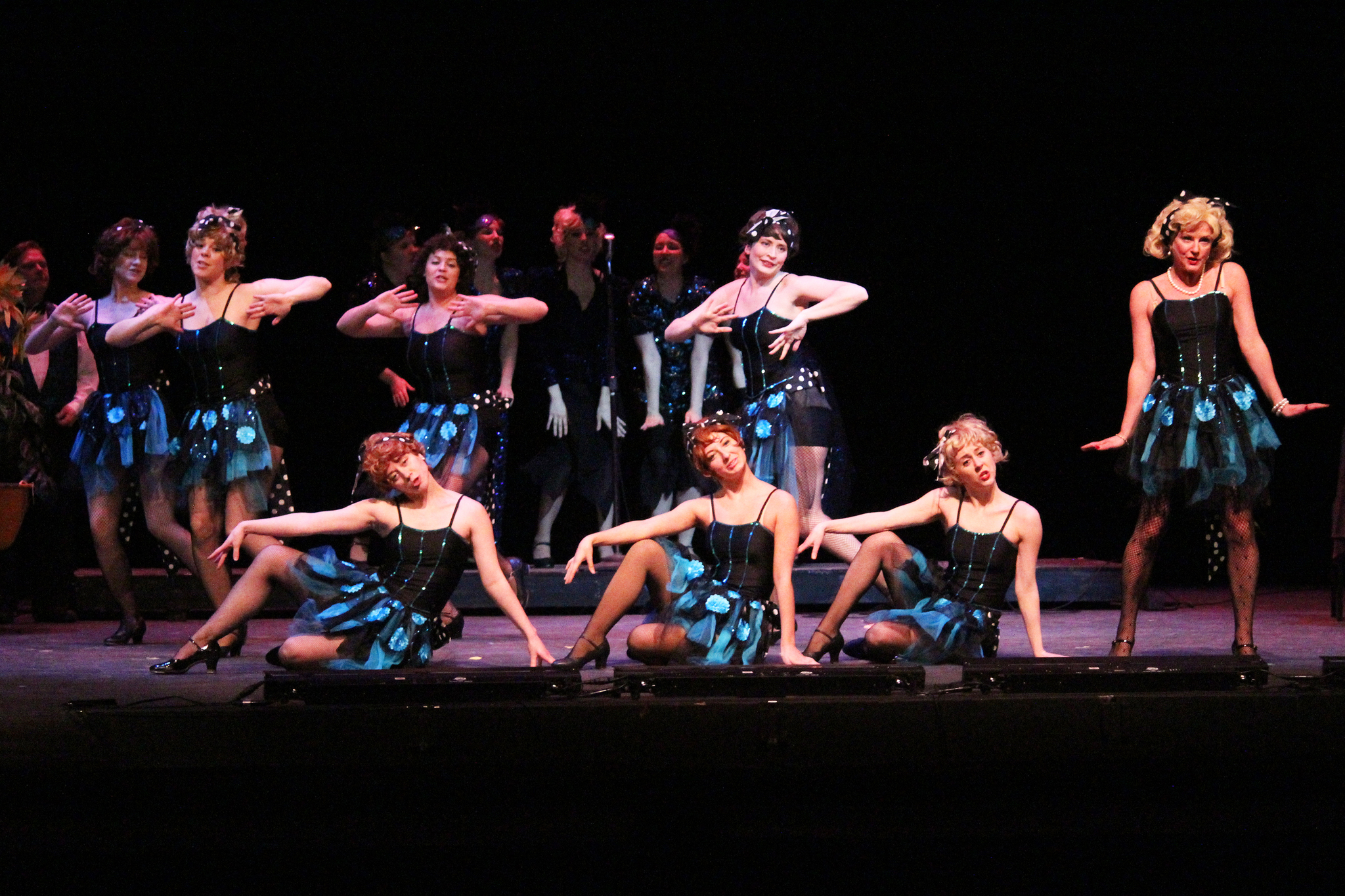 Cast members perform a song and dance number during a run-through of “Guys and Dolls” on Tuesday, Feb. 21, 2017 at the Renee C. Henderson Auditorium in Kenai, Alaska. (Megan Pacer/Peninsula Clarion)