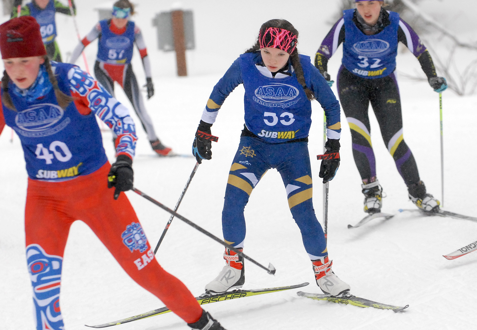 Homer’s Katie Davis races amid a pack of skiers at the state ski championships at Kincaid Park in Anchorage (Photo by Matt Tunseth/Alaska Star)