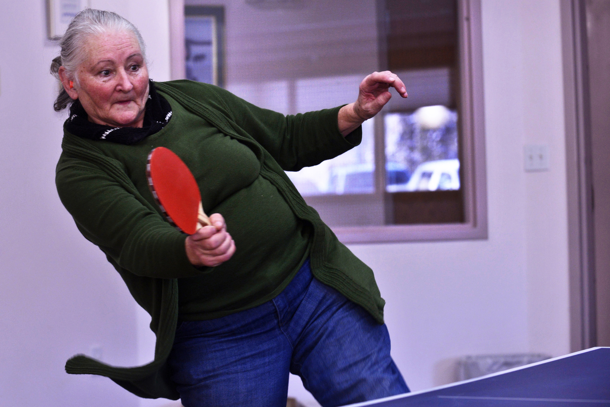 Deborah Thomas takes a swing during a game of ping pong on Saturday, Feb. 25, 2017 at the Soldotna Senior Center in Soldotna, Alaska. (Ben Boettger/Peninsula Clarion)