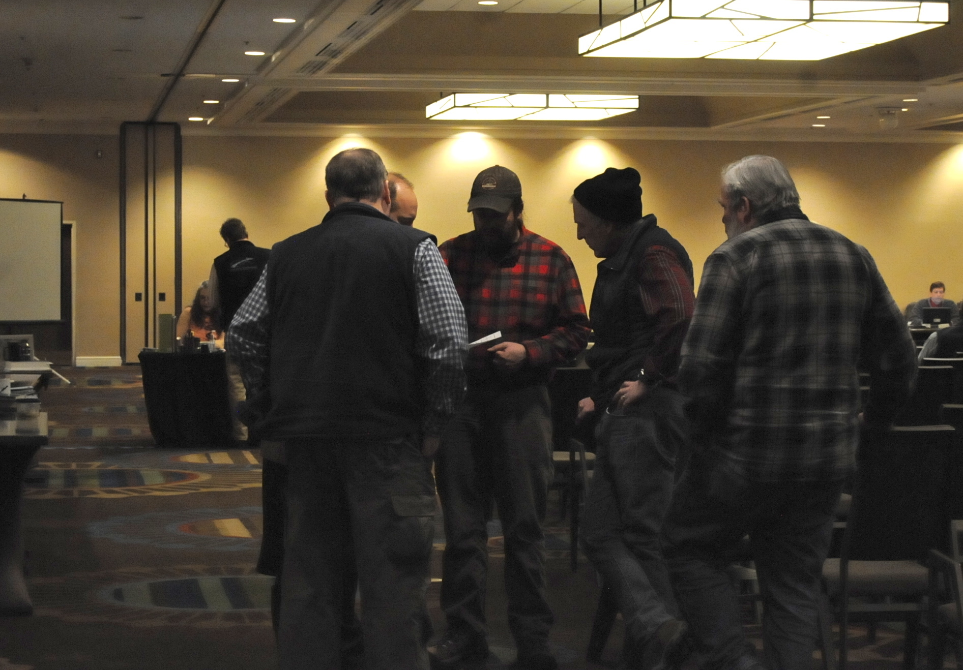 A group of commercial east side setnetters gather to discuss proposals at the Upper Cook Inlet Board of Fisheries meeting on Monday, Feb. 27, 2017 in Anchorage, Alaska. (Elizabeth Earl/Peninsula Clarion)