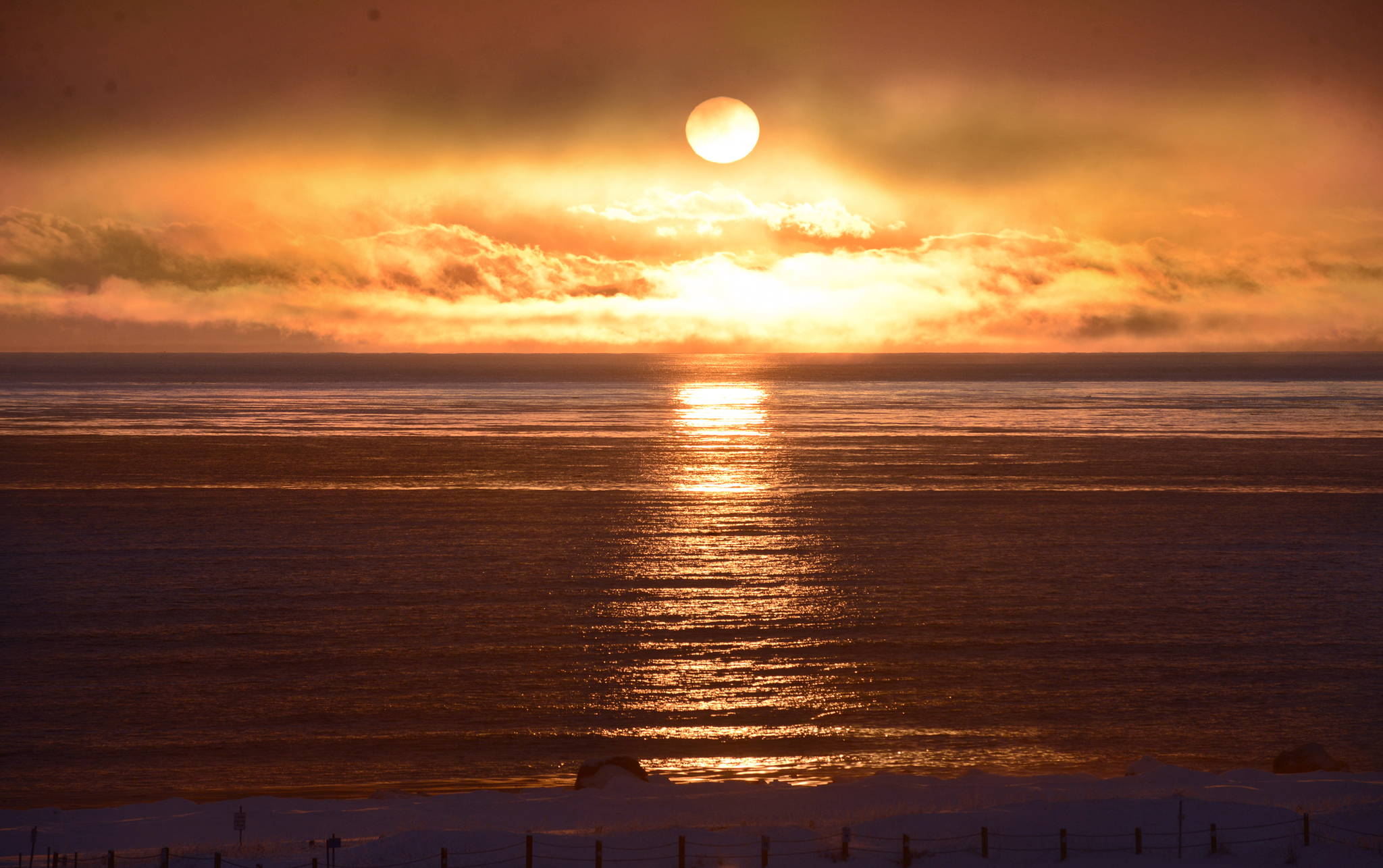 The sun sets over Cook Inlet, near the mouth of the Kenai River, on Monday, Feb. 27, 2017 in Kenai, Alaska. The central Kenai Peninsula is gaining more than five minutes of daylight each day. The sun will rise today at 8:07 a.m. and set at 6:29 p.m. (Photo by Ben Boettger/Peninsula Clarion)