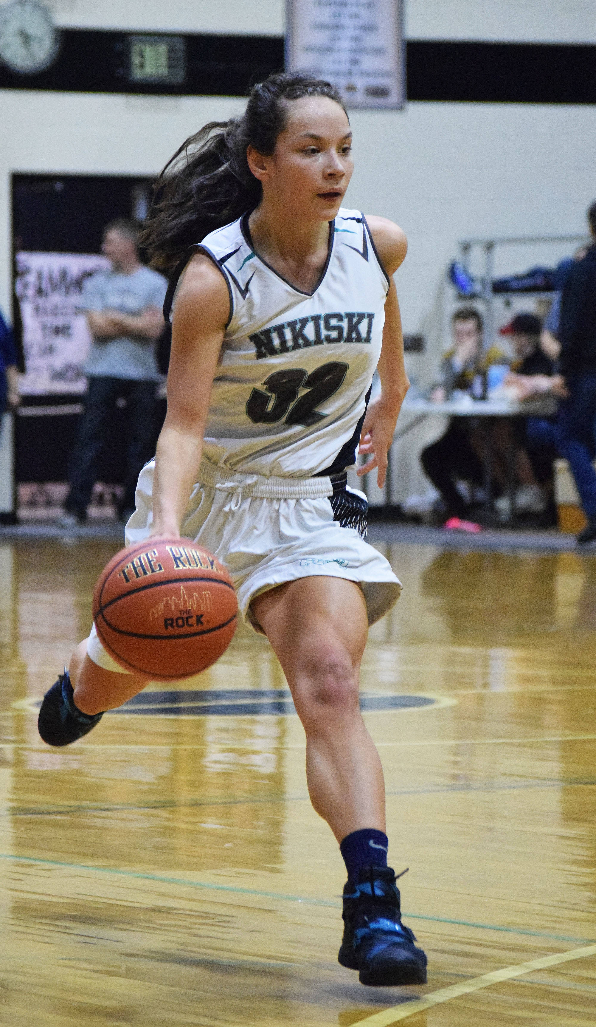 Nikiski’s Rylee Jackson dribbles down the court Friday against Grace Christian at the Southcentral Conference basketball tournament at Nikiski High School. (Photo by Joey Klecka/Peninsula Clarion)