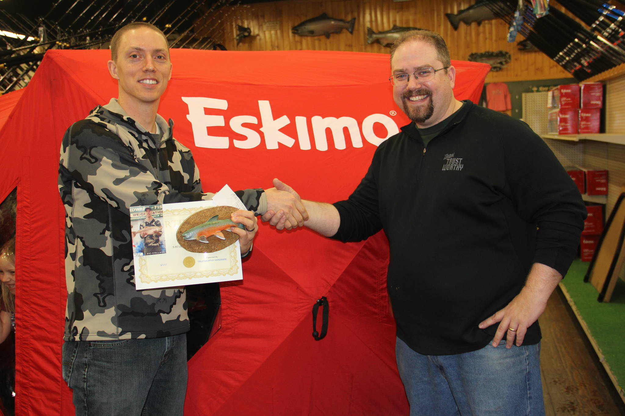 Big fish winners claim prizes in 20th Annual Ice Fishing Derby.