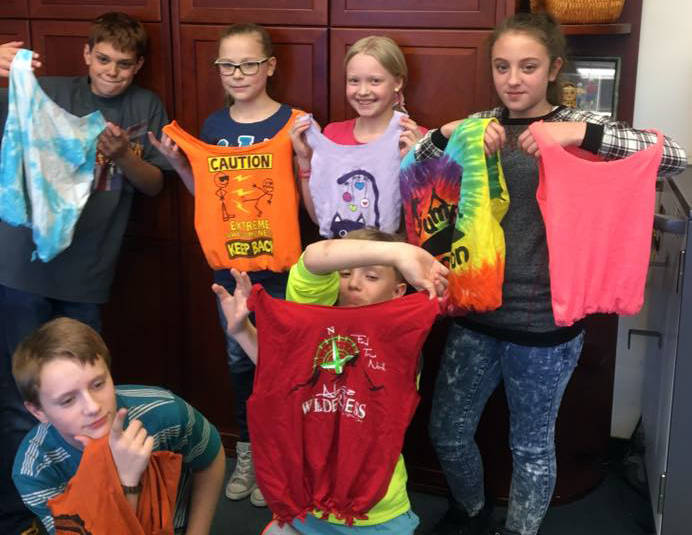 Sixth grade students at Soldotna Montessori Charter School fashioned the bags they made using donated T-shirts, in an effort to reduce the use of plastic bags. (Photo courtesy Terri Carter)