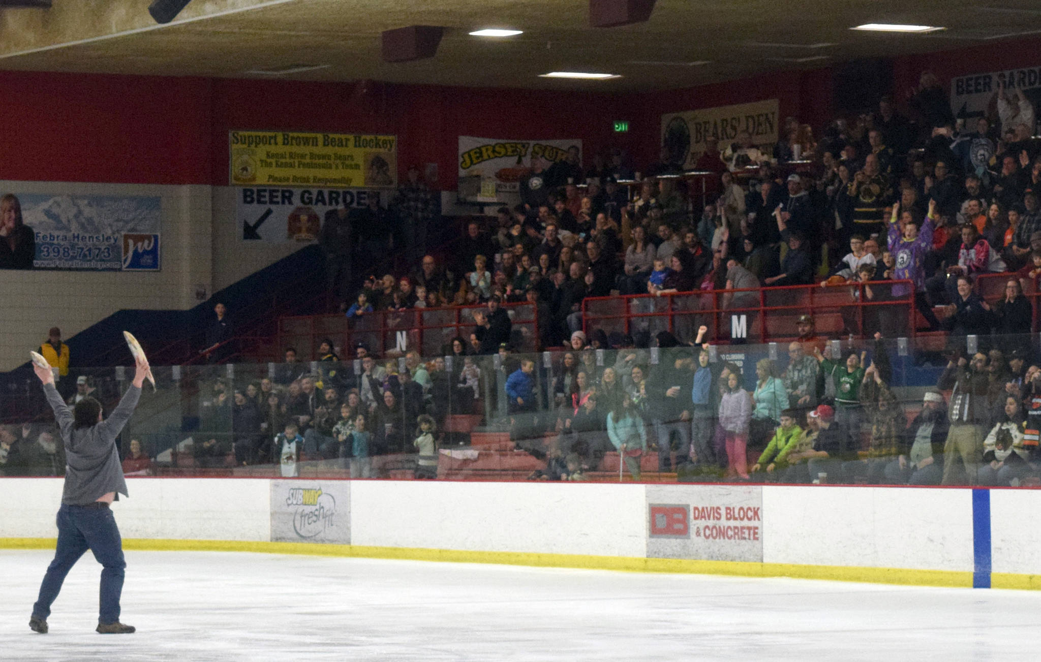 Brown Bears fans celebrate Luke Radetic’s goal in the third period by throwing the customary fish on the ice Friday, March 24, 2017, at the Soldotna Regional Sports Complex. (Photo by Jeff Helminiak/Peninsula Clarion)