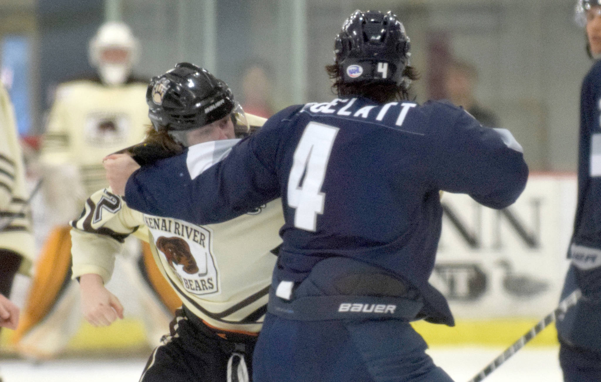 Carter Wade of the Kenai River Brown Bears and Tim Gelatt of the Wilkes-Barre/Scranton (Pennsylvania) Knights square off in the first period Friday, March 24, 2017, at the Soldotna Regional Sports Complex. (Photo by Jeff Helminiak/Peninsula Clarion)