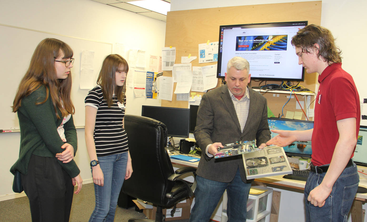 Kenai Central High School juniors shadow North Tech Group owner Tim Jordon during Job Shadow Day.