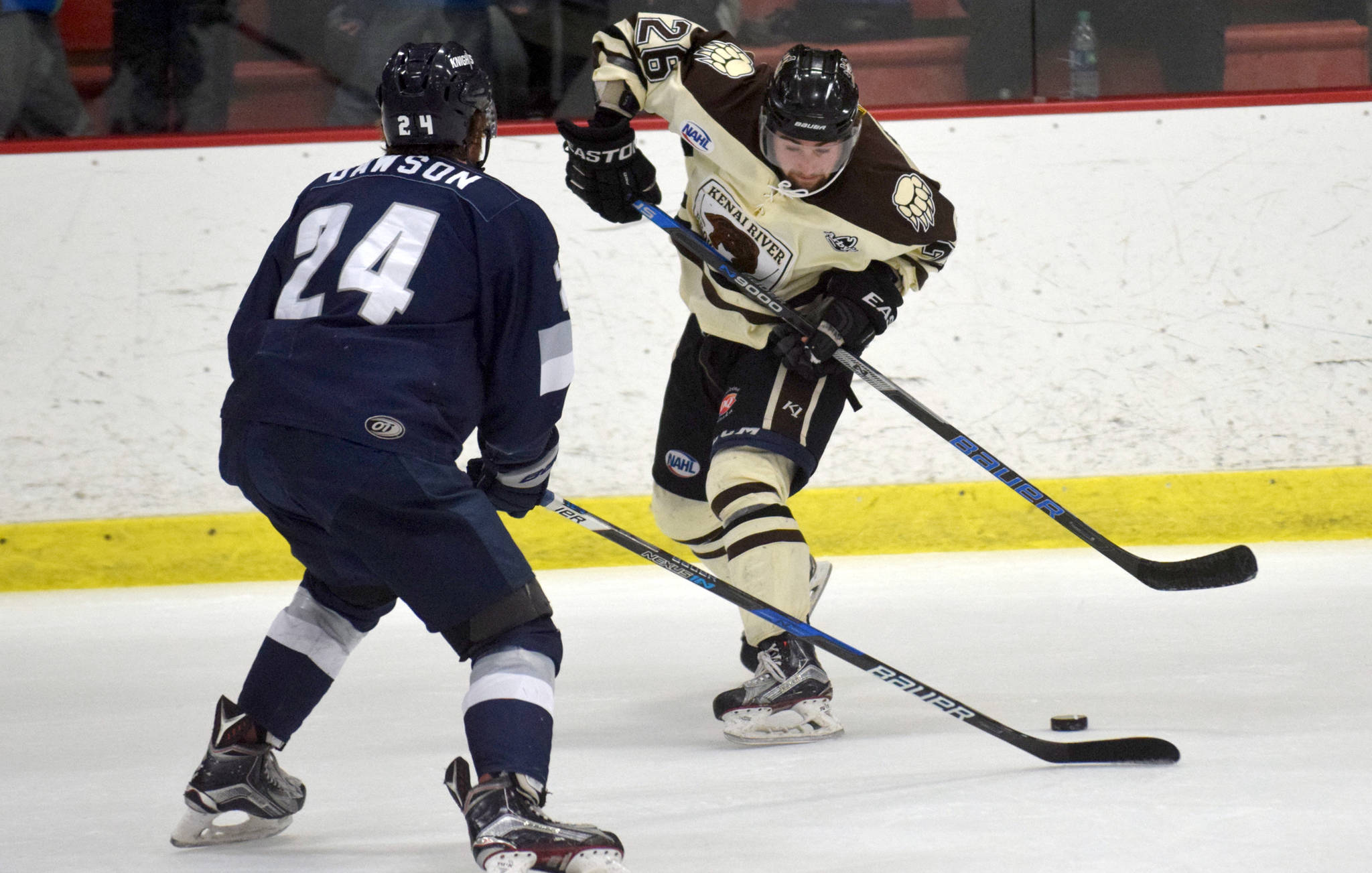 Kenai River Brown Bears forward Jonathan Marzec makes a move on Wilkes-Barre/Scranton (Pennsylvania) Knights defenseman Dorian Dawson on Friday, March 24, 2017, at the Soldotna Regional Sports Complex. (Photo by Jeff Helminiak/Peninsula Clarion)