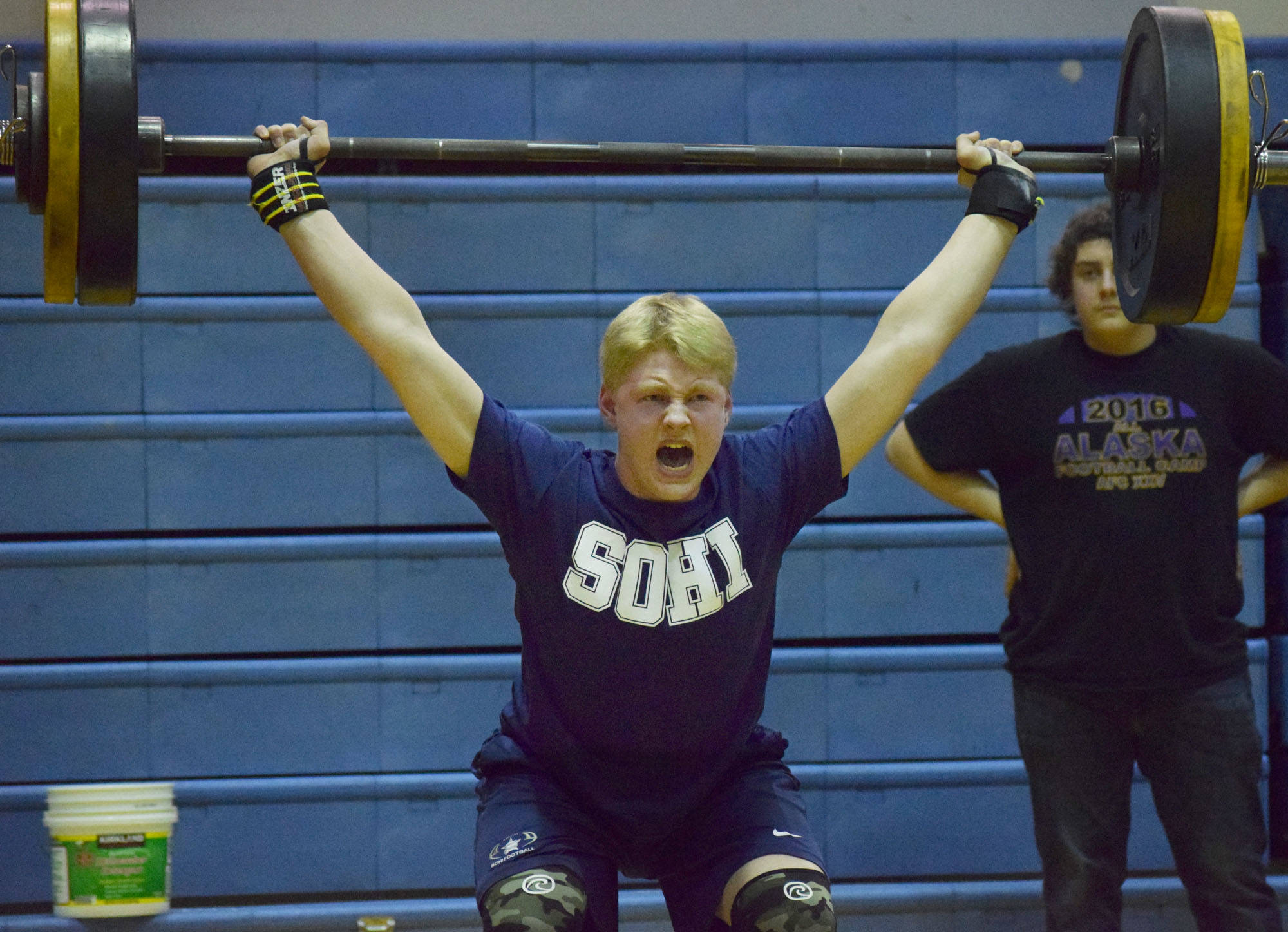 Soldotna freshman Galen Brantley III cleans and jerks Wednesday evening at the 11th biannual CrossFit Competition at Soldotna High School. (Photo by Joey Klecka/Peninsula Clarion)