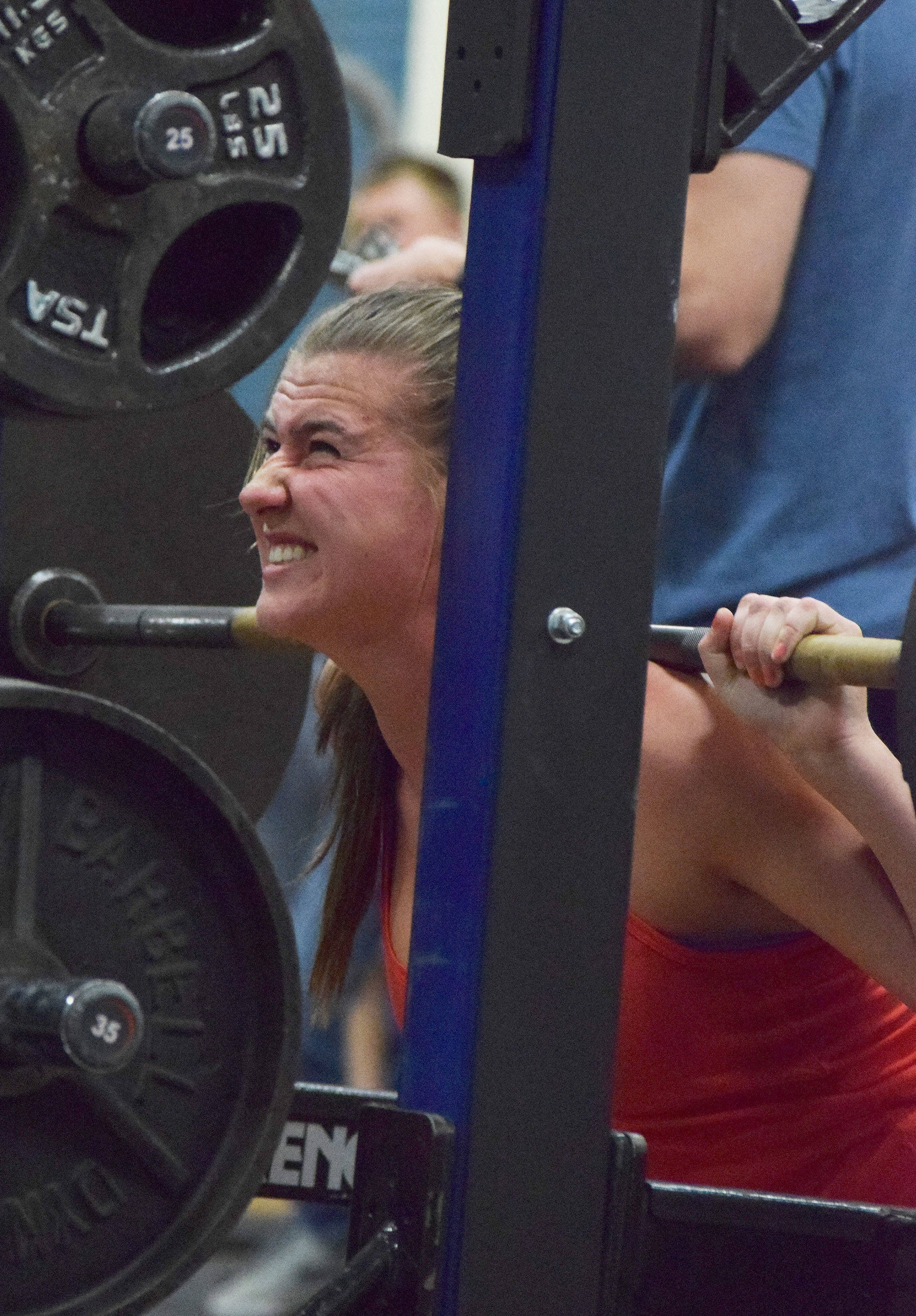 Kenai Central sophomore Olivia Brewer squats Wednesday evening at the 11th biannual CrossFit Competition at Soldotna High School. (Photo by Joey Klecka/Peninsula Clarion)