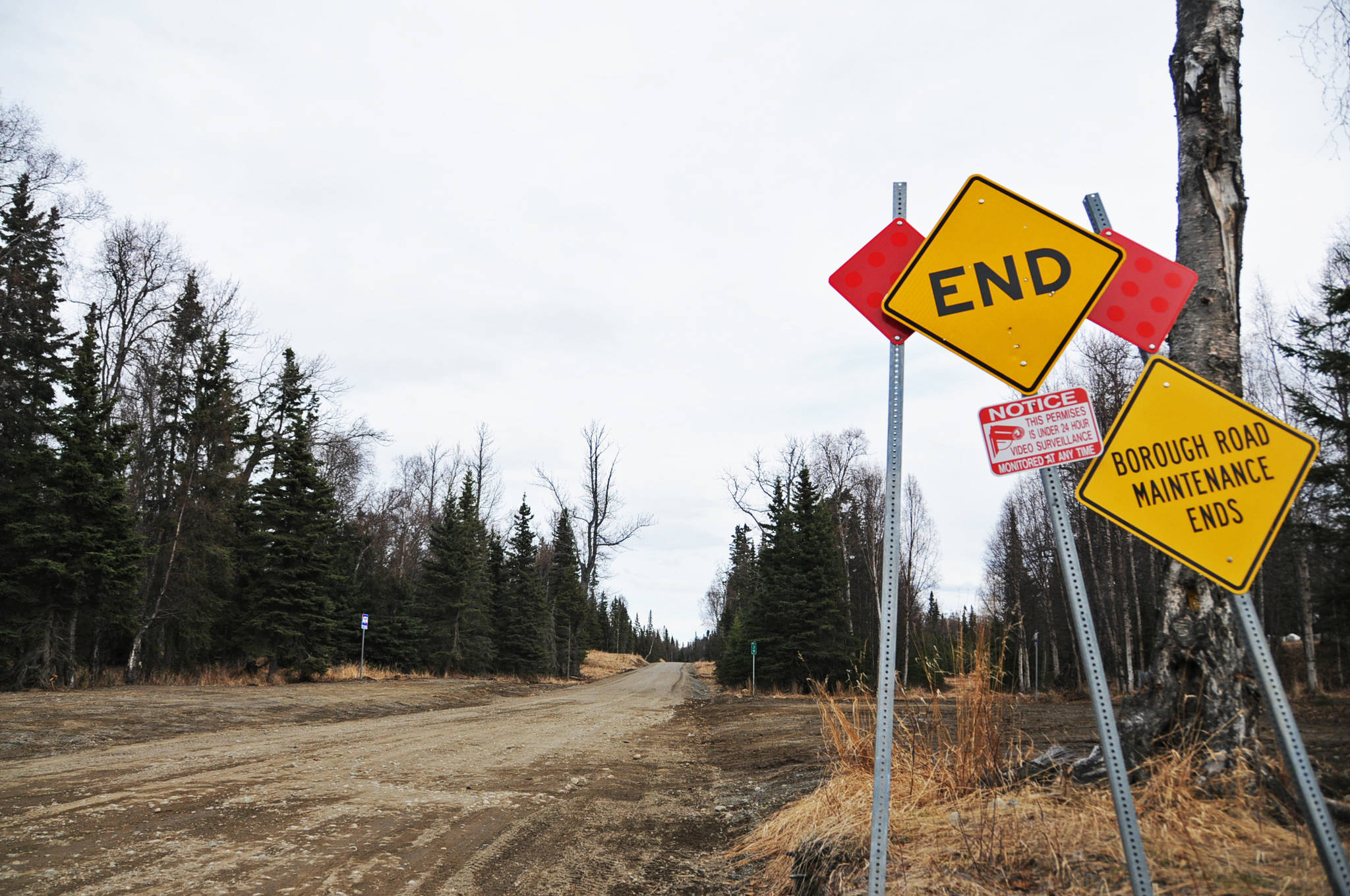 The road to Gray Cliff and Moose Point extends past the pavement in Captain Cook State Park, shown on Monday, April 11, 2016 near Nikiski, Alaska. Apache Corporation, which was exploring for oil and gas in the area, had announced plans to extend the road to Gray Cliff before the company’s withdrawal from Alaska in March 2016. The Kenai Peninsula Borough is working on plans to pick up the project and plans to go out to bid in the fall. (Elizabeth Earl/Peninsula Clarion, file)