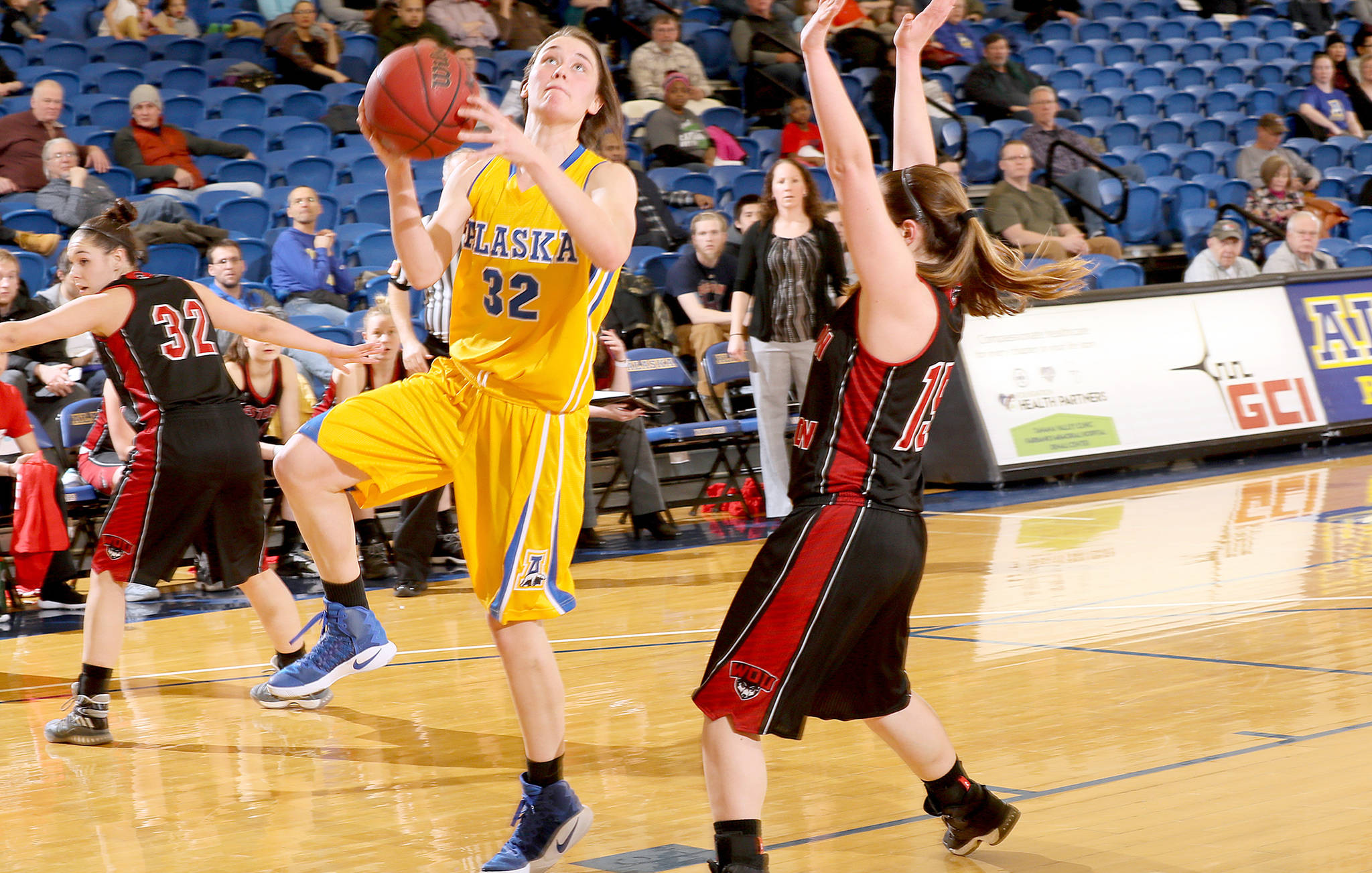 University of Alaska Fairbanks senior Kaillee Skjold drives to the basket in early February 2017. (Photo courtesy of UAF/Paul H. McCarthy)