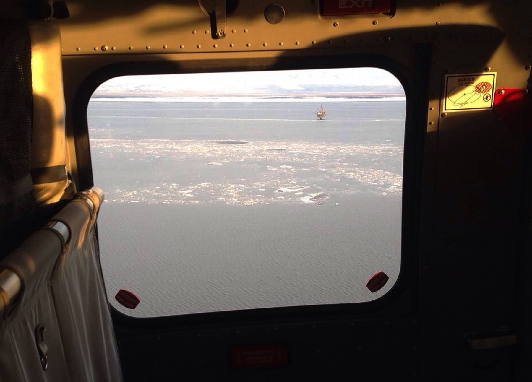 This photo provided by Cook Inlet Spill Prevention and Response, Inc. shows pan pan ice taken during an agency overflight near a Hilcorp Alaska LLC offshore platform in Cook Inlet, Alaska, Monday, April 3, 2017. Officials said an underwater pipeline spill between two production platforms owned by Hilcorp dumped less than three gallons (11 liters) of oil into Cook Inlet. (Derek Samora/CISPRI via AP)