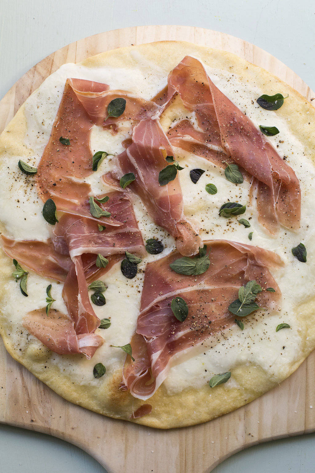 This February 2017 photo shows a burrata and prosciutto pizza in New York. This dish is from a recipe by Katie Workman. (Sarah Crowder via AP)