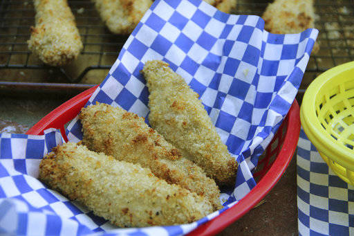 This March 26, 2017 photo shows Dijon and sherry chicken tenders in Coronado, Calif. This dish is from a recipe by Melissa d’Arabian. (Melissa d’Arabian via AP)