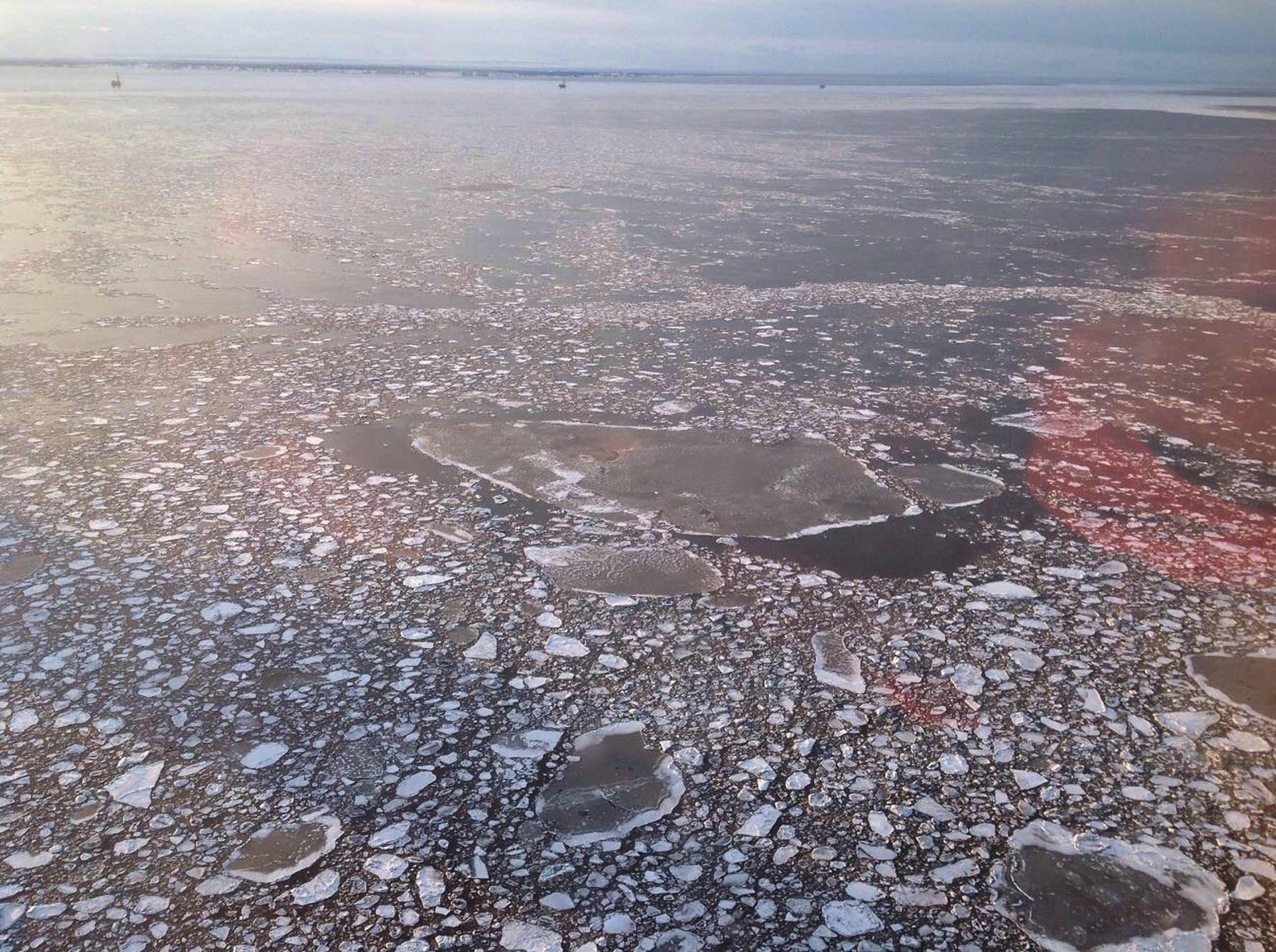 This photo taken during an agency overflight and provided by Cook Inlet Spill Prevention and Response Inc. shows pan ice near a Hilcorp Alaska offshore platform in Cook Inlet on April 3, 2017. Officials said an underwater pipeline spill between two production platforms owned by Hilcorp dumped less than three gallons. The oil incident and a separate, and still leaking, natural gas line have highlighted the challenges of responding to spills in Cook Inlet caused by ice floes, wind and some of the strongest tidal currents in the world. (AP Photo/Derek Samora/CISPRI)