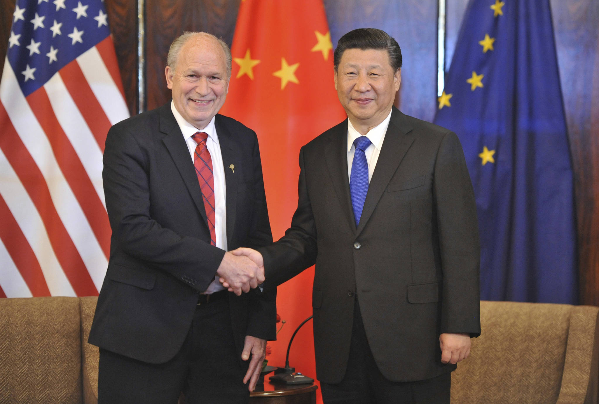Chinese President Xi Jinping, right, and Alaska Governor Bill Walker greet each other at a meeting Friday, April 7, 2017, in Anchorage, Alaska. Xi requested time with Gov. Walker Friday night as the Chinese delegation’s plane made a refueling stop in Alaska’s largest city following meetings with President Donald Trump in Florida. (AP Photo/Michael Dinneen)