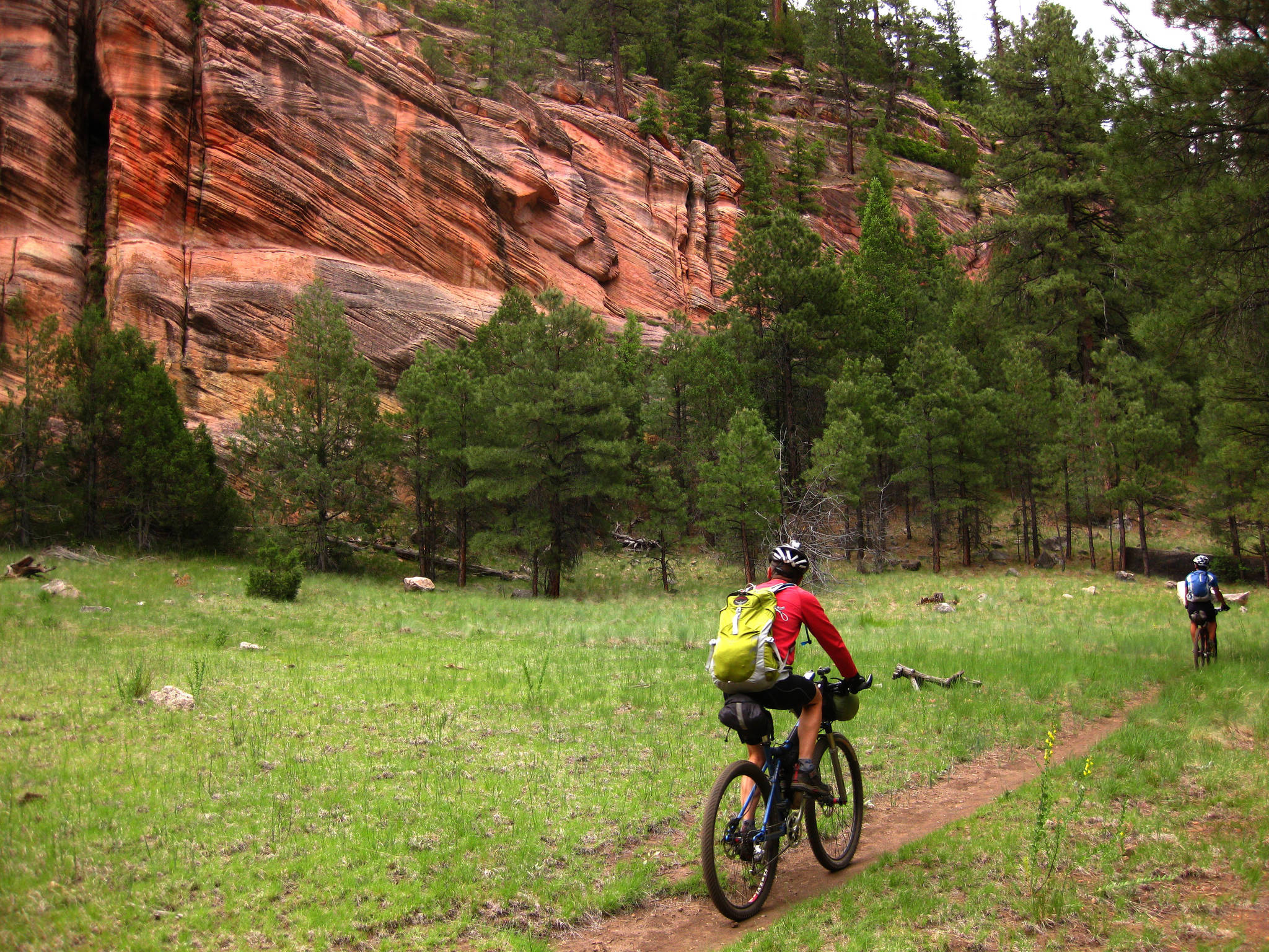 In this June 23, 2009 photo provided by Scott Morris, Lee Blackwell and Chad Brown are shown bikepacking a segment of the Arizona Trail, south of Flagstaff, Ariz. (Scott Morris via AP)