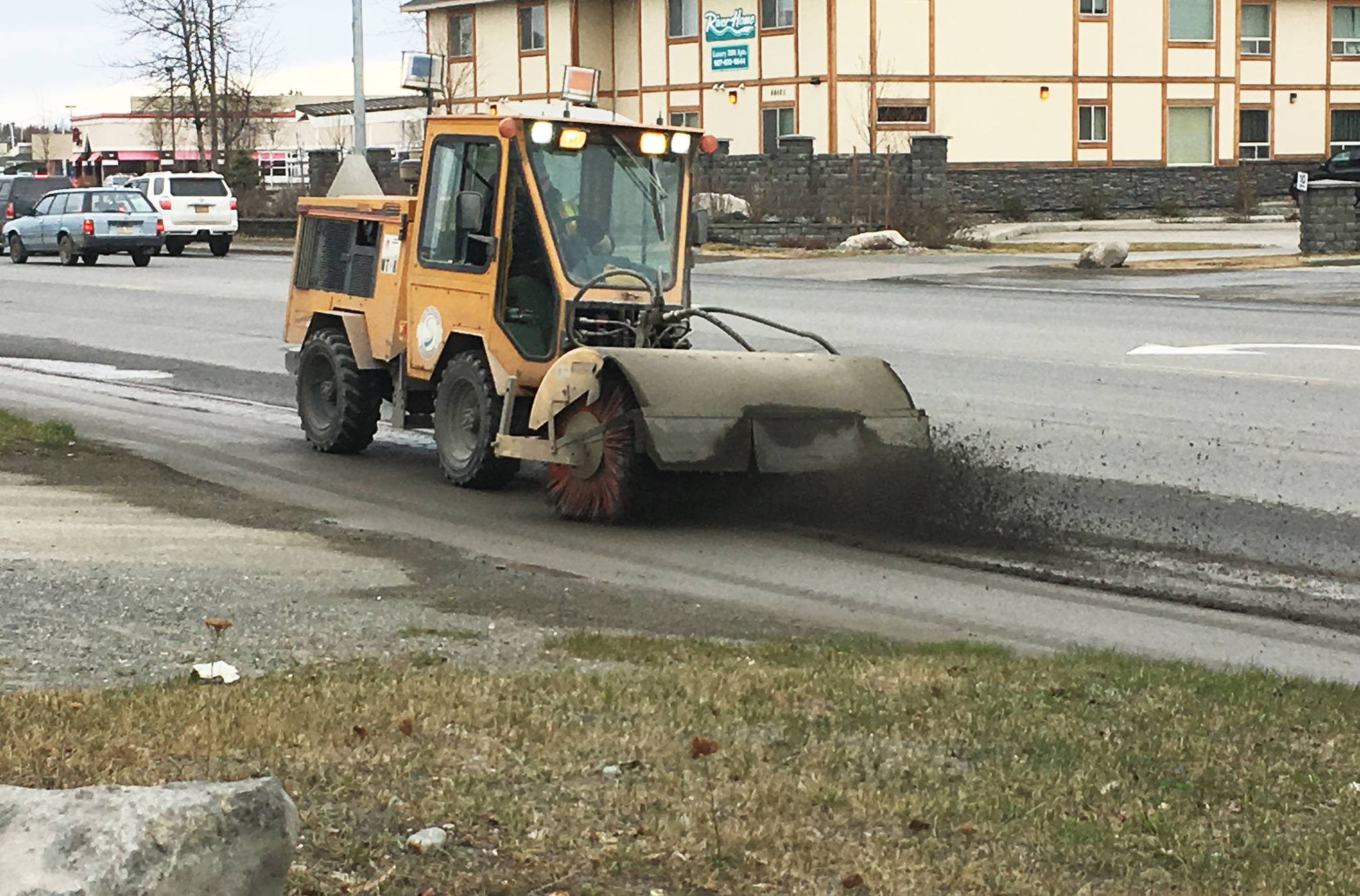 This April 2016 photo shows City of Soldotna crew cleaning along the Sterling Highway under ‘wet’ conditions. An ordinance passed last summer sets standards for clearing sand from streets and parking lots in order to reduce the amount of dust that gets into the air. (Photo courtesy Scott Sundberg, Soldotna Maintenance Department Manager)