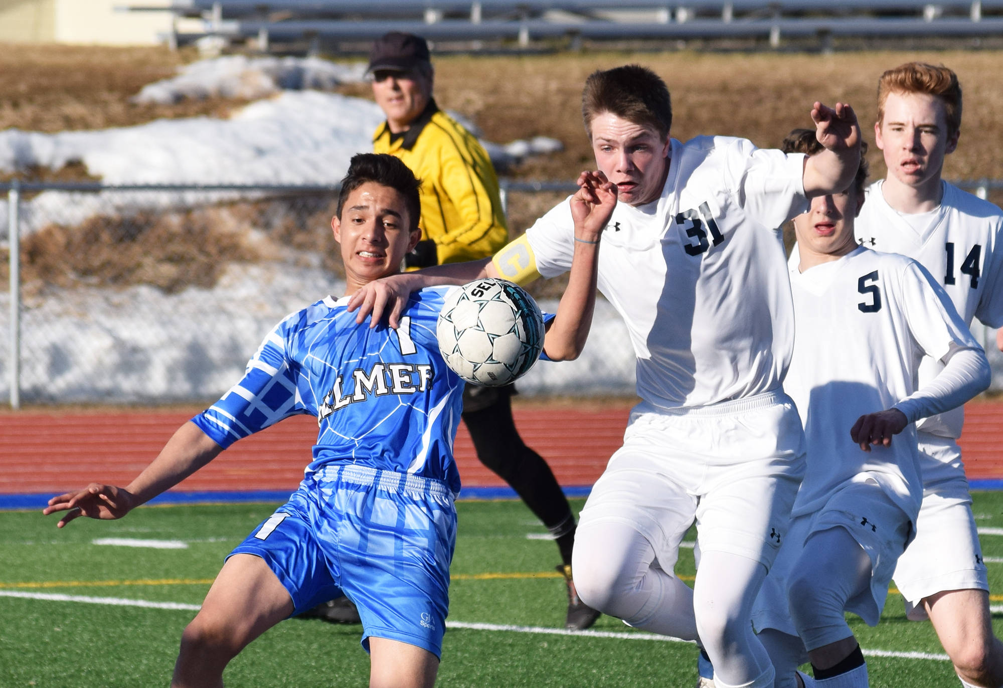Soldotna junior Eli Sheridan (31) fights for the ball in the Palmer goalie box against Palmer’s Isaiah Montoya, Friday afternoon at Justin Maile Field in Soldotna. (Photo by Joey Klecka/Peninsula Clarion)