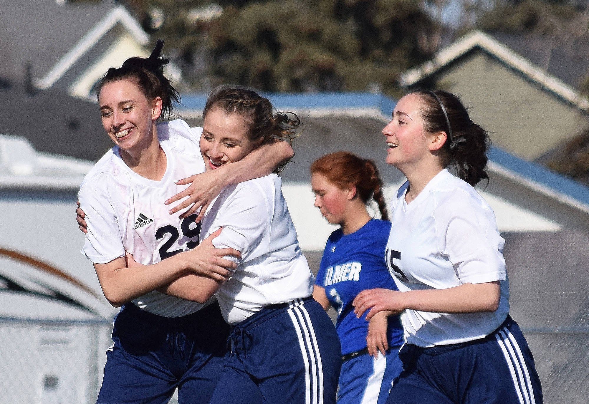 Soldotna’s Abi Tuttle (left) congratulates freshman teammate Ryann Cannava on her second-half goal against Palmer, Friday afternoon at Justin Maile Field in Soldotna. (Photo by Joey Klecka/Peninsula Clarion)